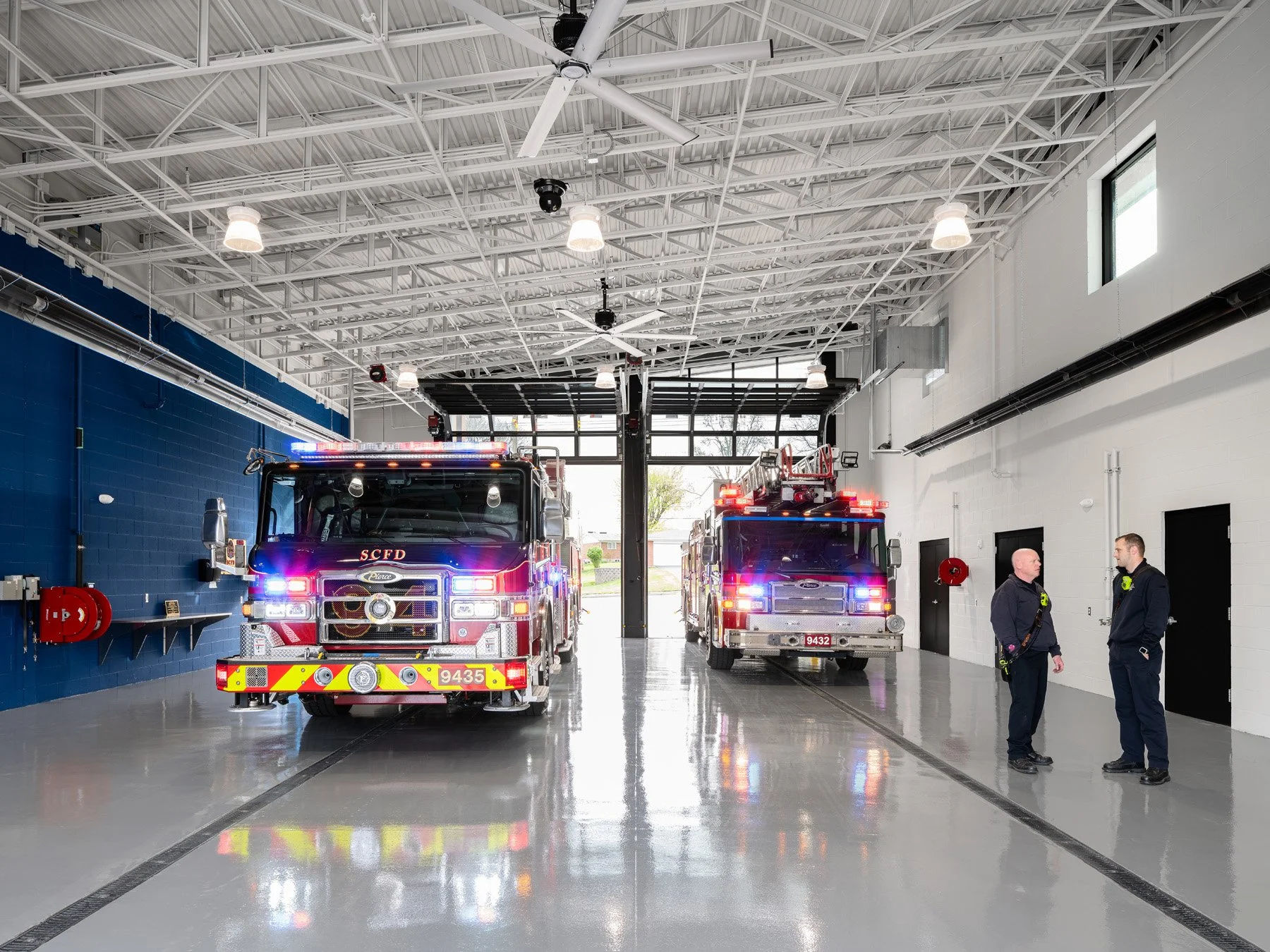 St. Charles fire station interior apparatus bay and blue accent wall, by JEMA, St. Charles Missouri - architectural photographer St. Louis Missouri
