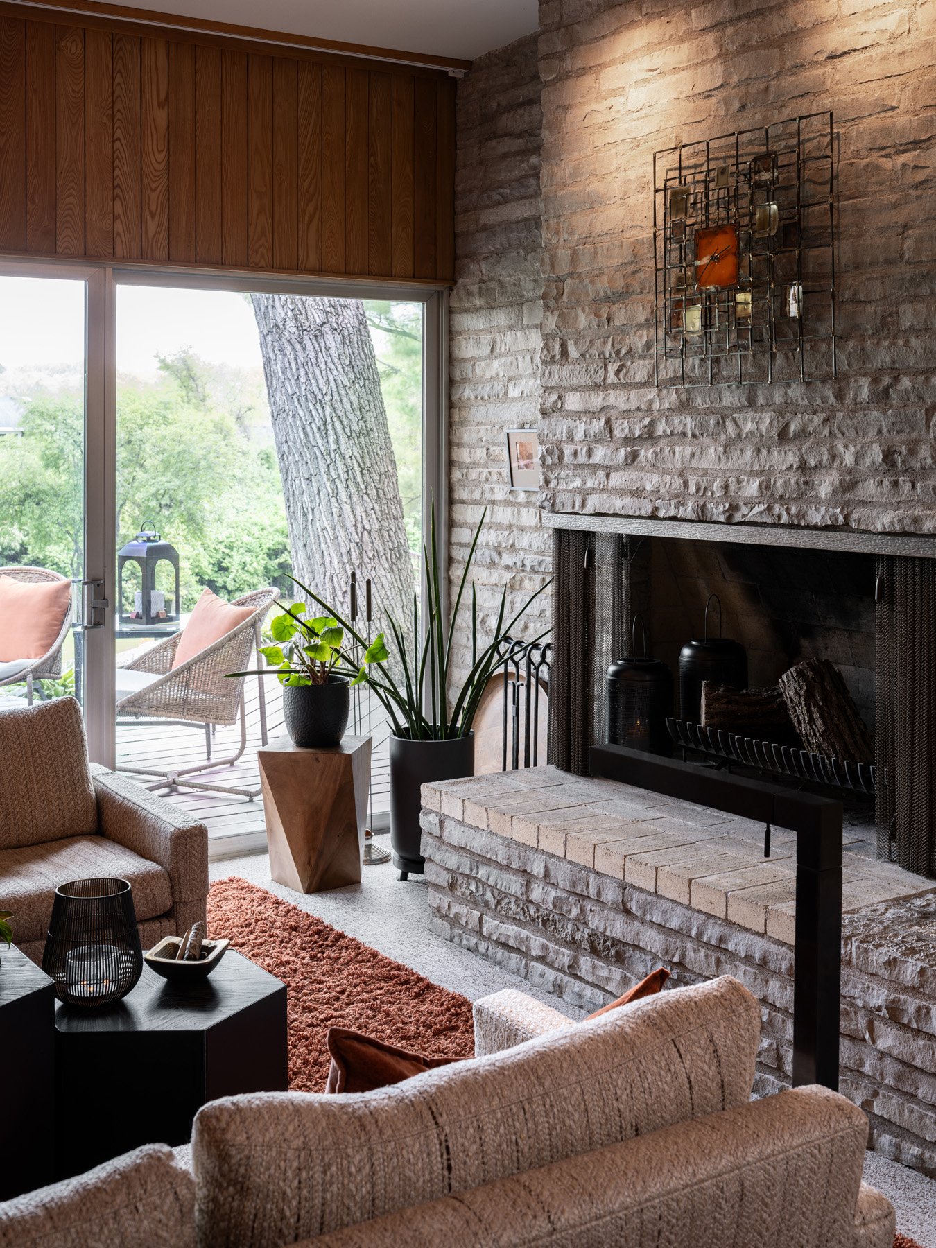 Garrison House family room with a stone fireplace and raised brick hearth, Sleepy Hollow Illinois - architectural photographer Chicago