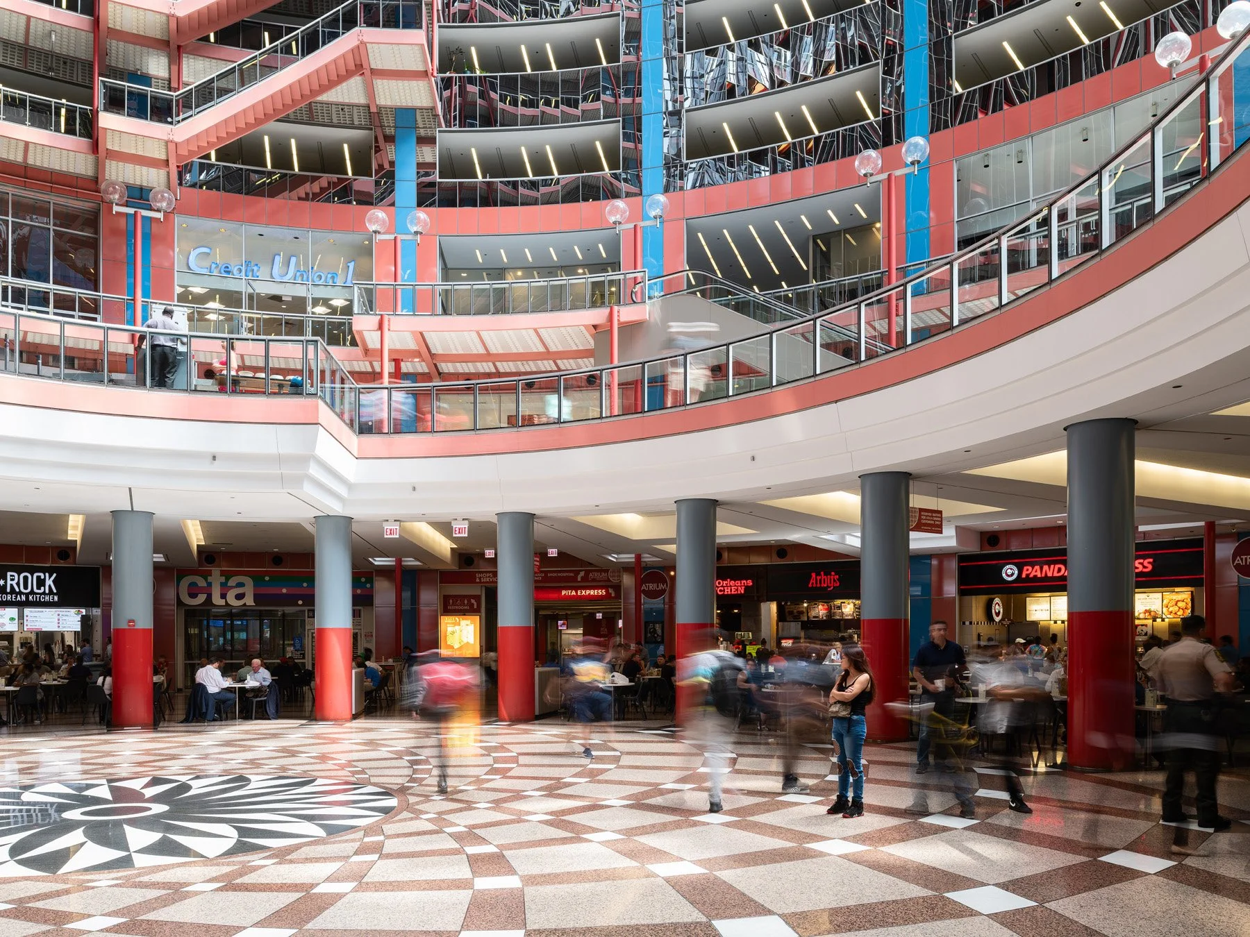 James R. Thompson Center food court level, columns and curving balcony over the rosette terrazzo, Chicago - radial floor pattern