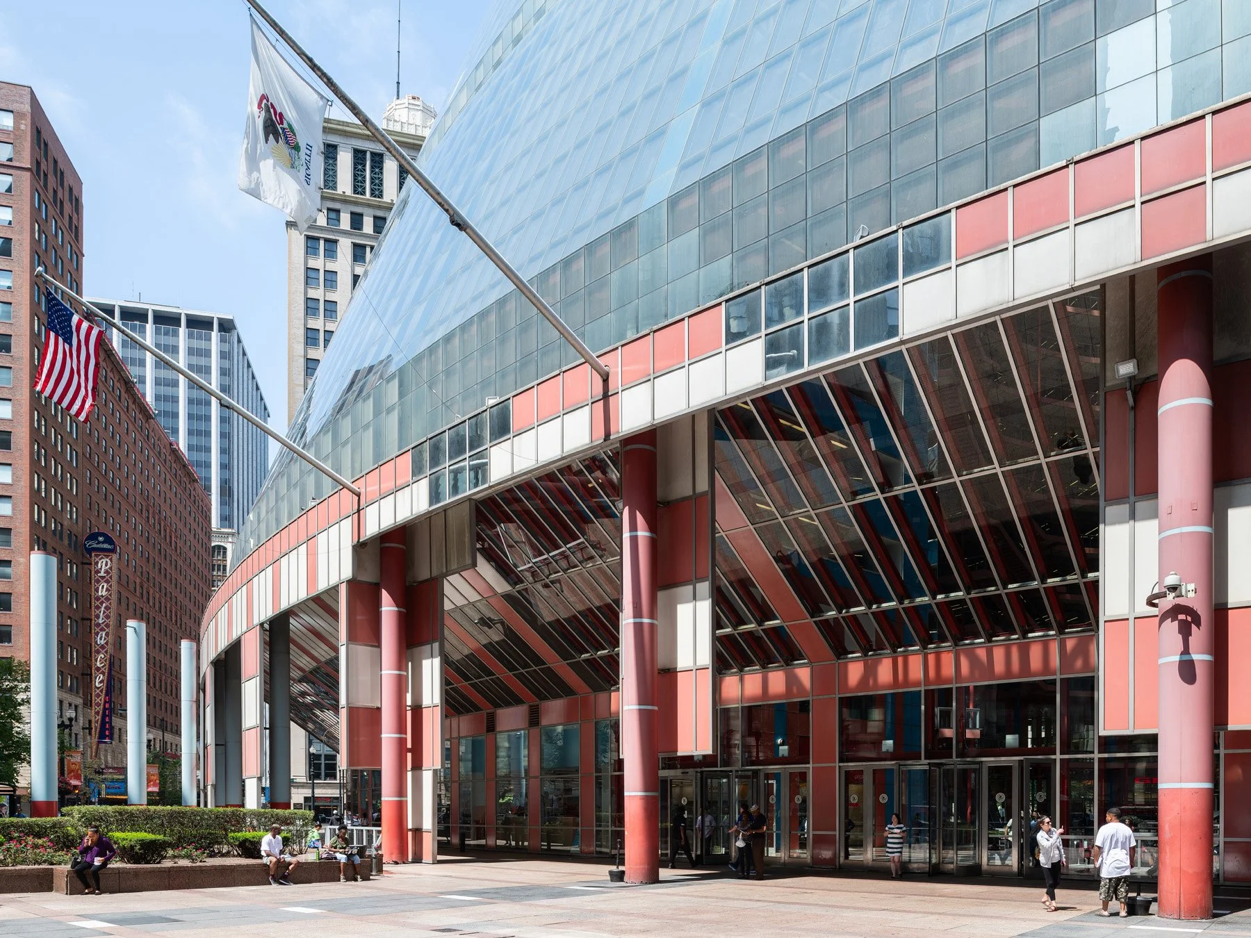 James R. Thompson Center southwest plaza, curved glass above the salmon arcade with state flags, Chicago - postmodern government building Loop