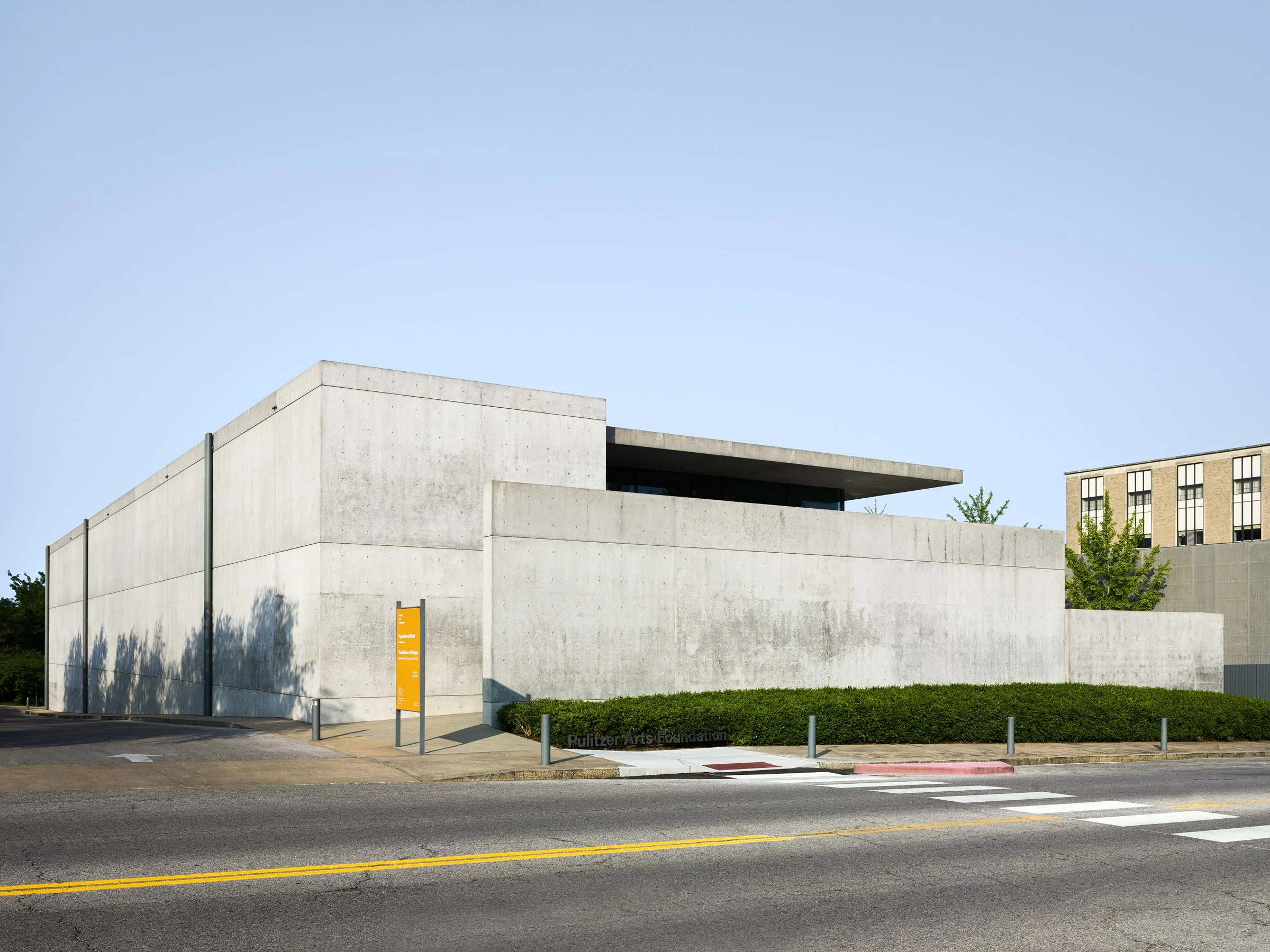 Pulitzer Arts Foundation exterior corner in low evening light showing the stacked concrete volumes and the cantilevered roof at the street, by Tadao Ando, St. Louis Missouri - architectural photographer St. Louis Missouri