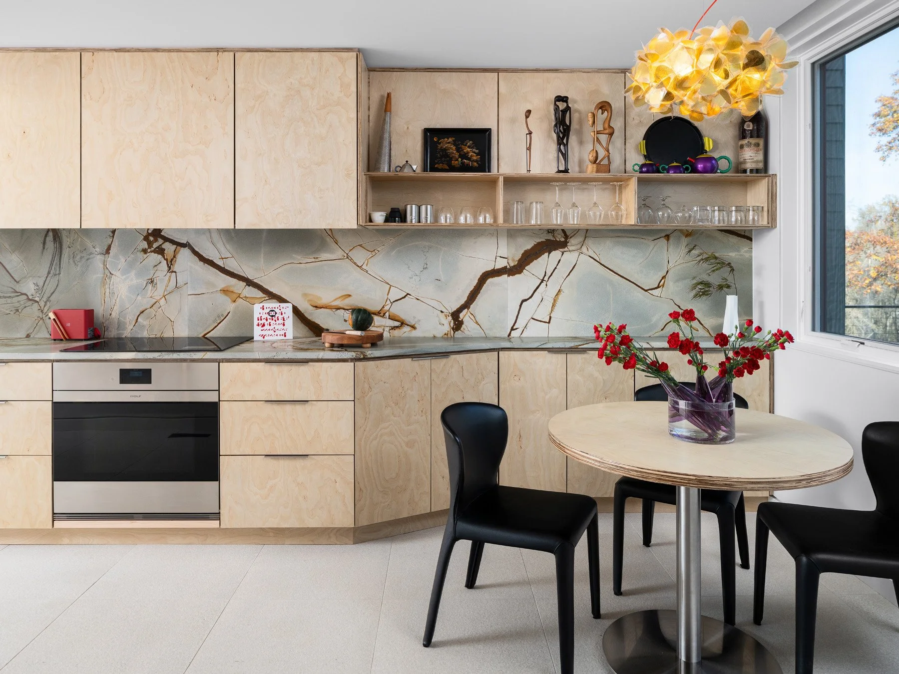 Monty Residence interior kitchen with birch plywood cabinets and stone backsplash, by Studio Lark - architectural photographer St. Louis Missouri
