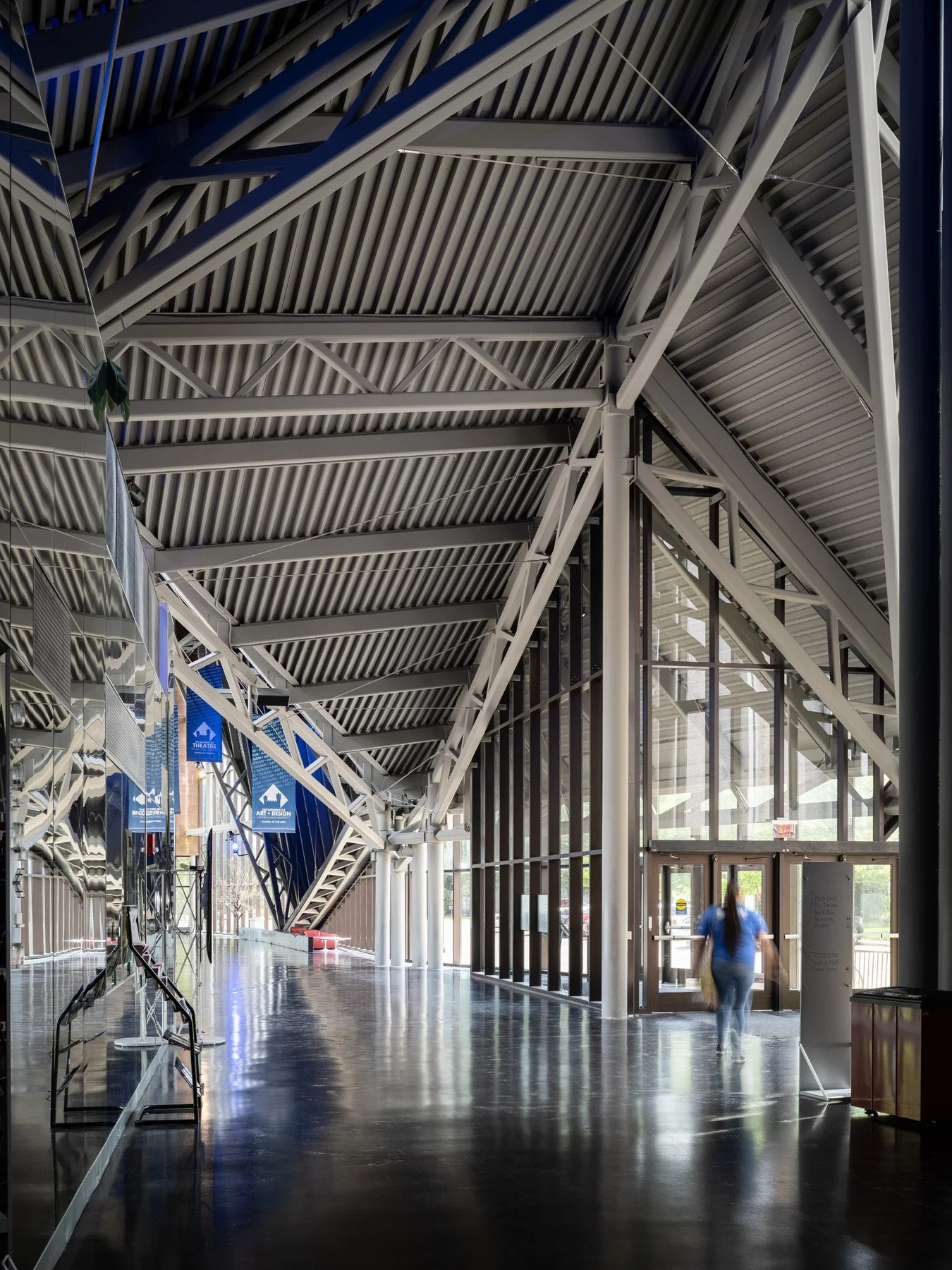 Doudna Fine Arts Center interior concourse with exposed white steel trusses and mirrored wall by Antoine Predock, Charleston Illinois - architectural photographer