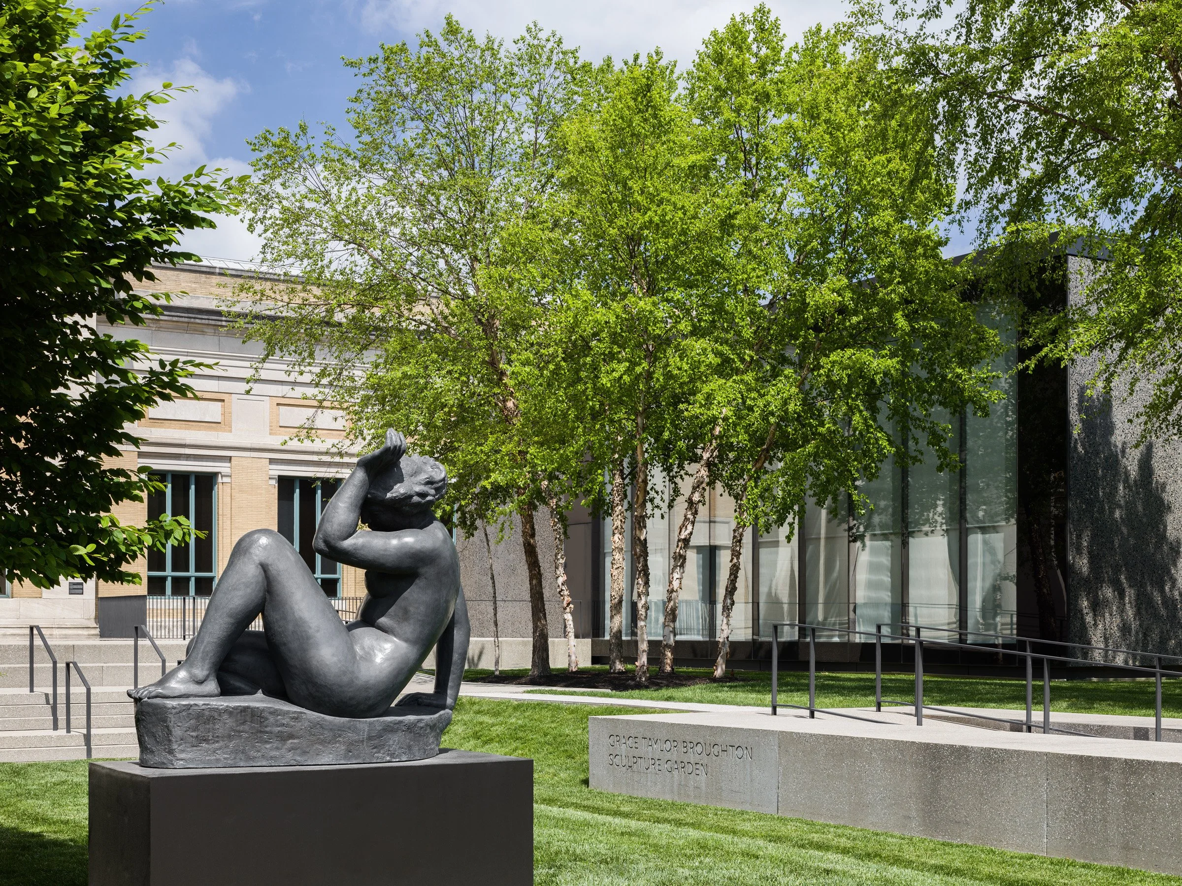 Saint Louis Art Museum reclining bronze by the glass facade, landscape by Michel Desvigne Paysagiste - architectural photographer St. Louis Missouri