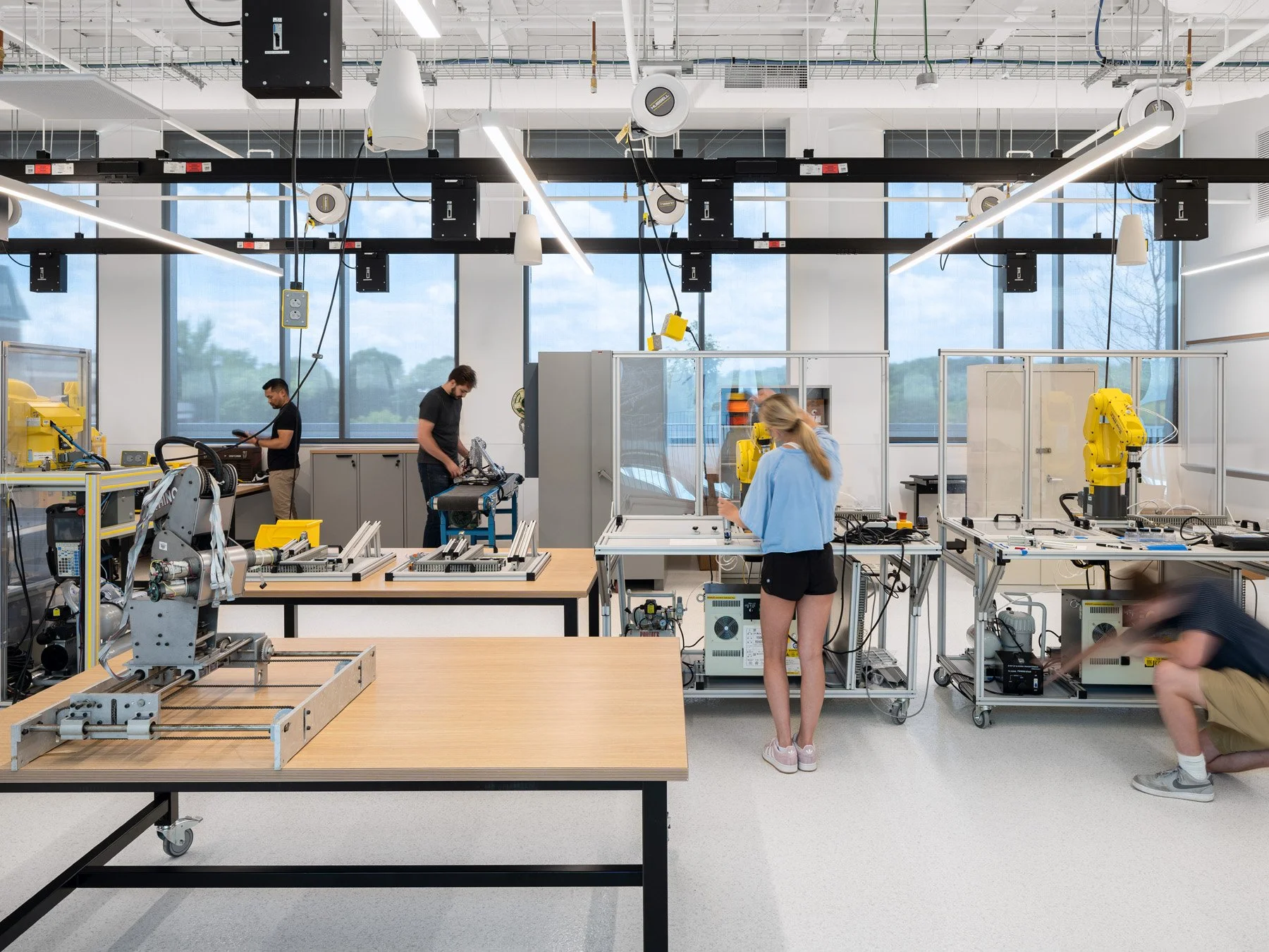 STLCC Florissant Valley Advanced Manufacturing Center robotics lab with yellow robot arms by JEMA - architectural photographer St. Louis Missouri
