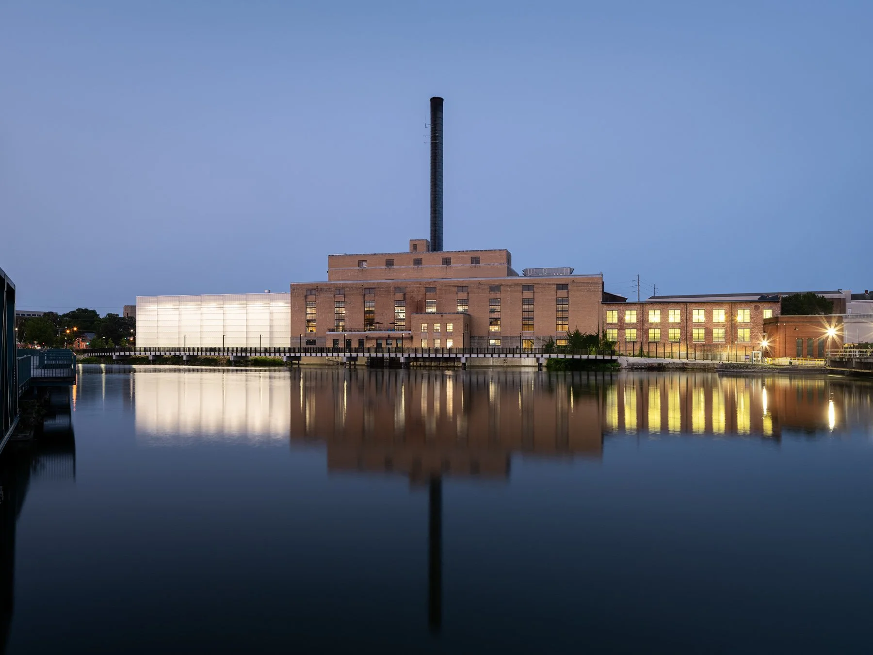 Beloit College Powerhouse and field house reflected across the Rock River at dusk, by Studio Gang - architectural photographer Beloit Wisconsin