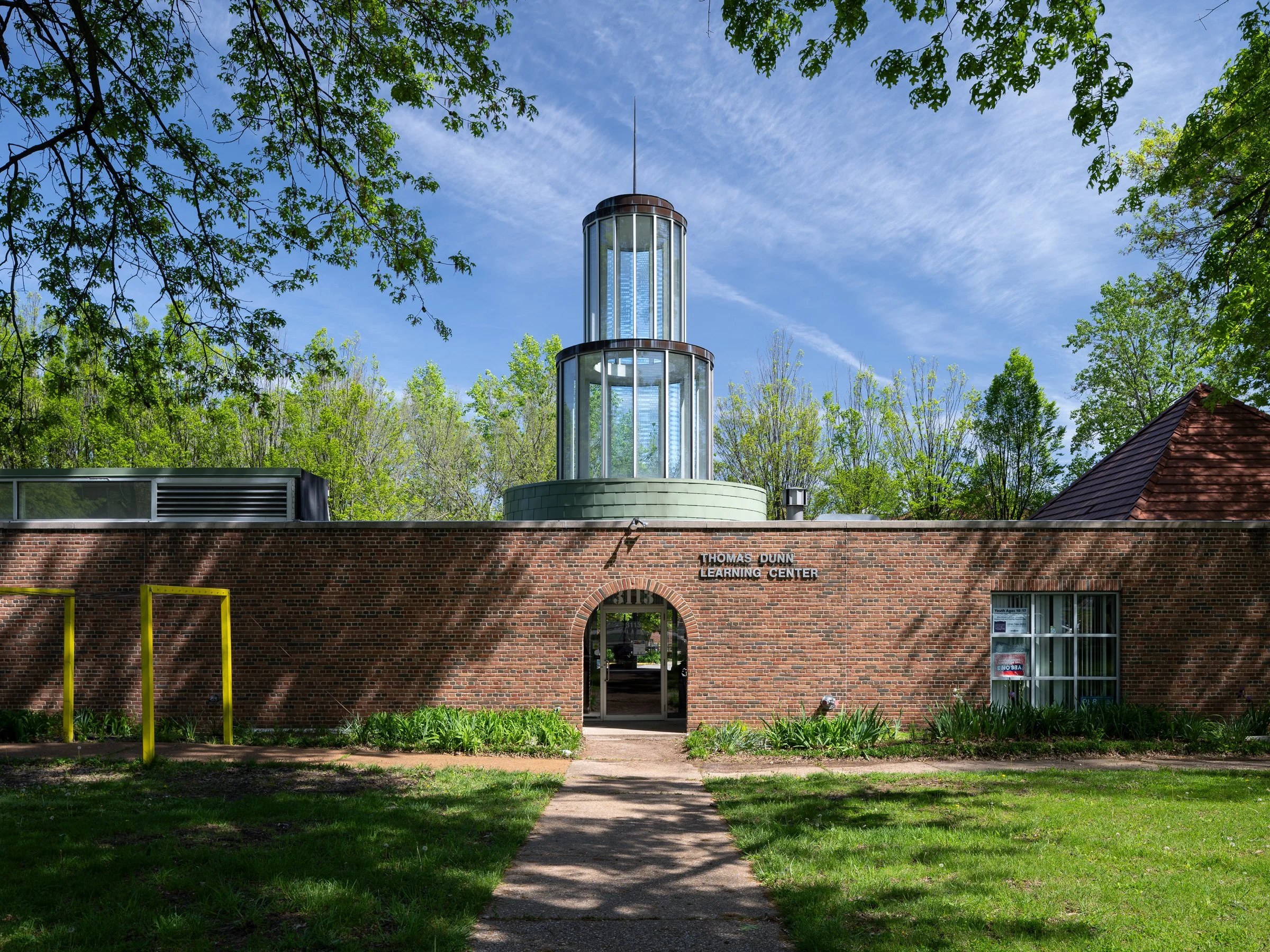 Thomas Dunn Learning Center glass entry beacon and brick facade by Ittner & Bowersox, St. Louis Missouri - architectural photographer St. Louis