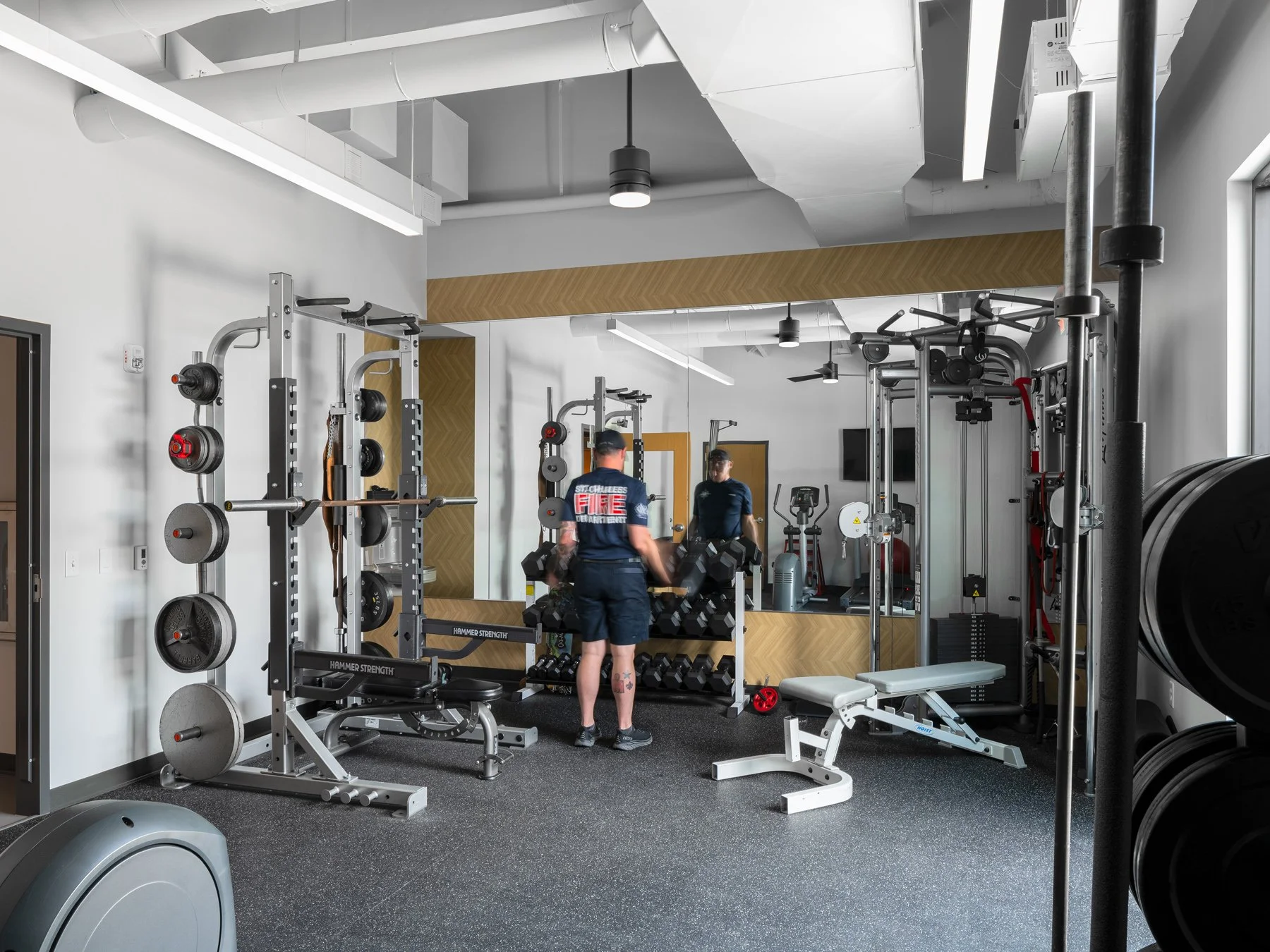 St. Charles fire station interior fitness room with weight racks, by JEMA, St. Charles Missouri - architectural photographer St. Louis Missouri
