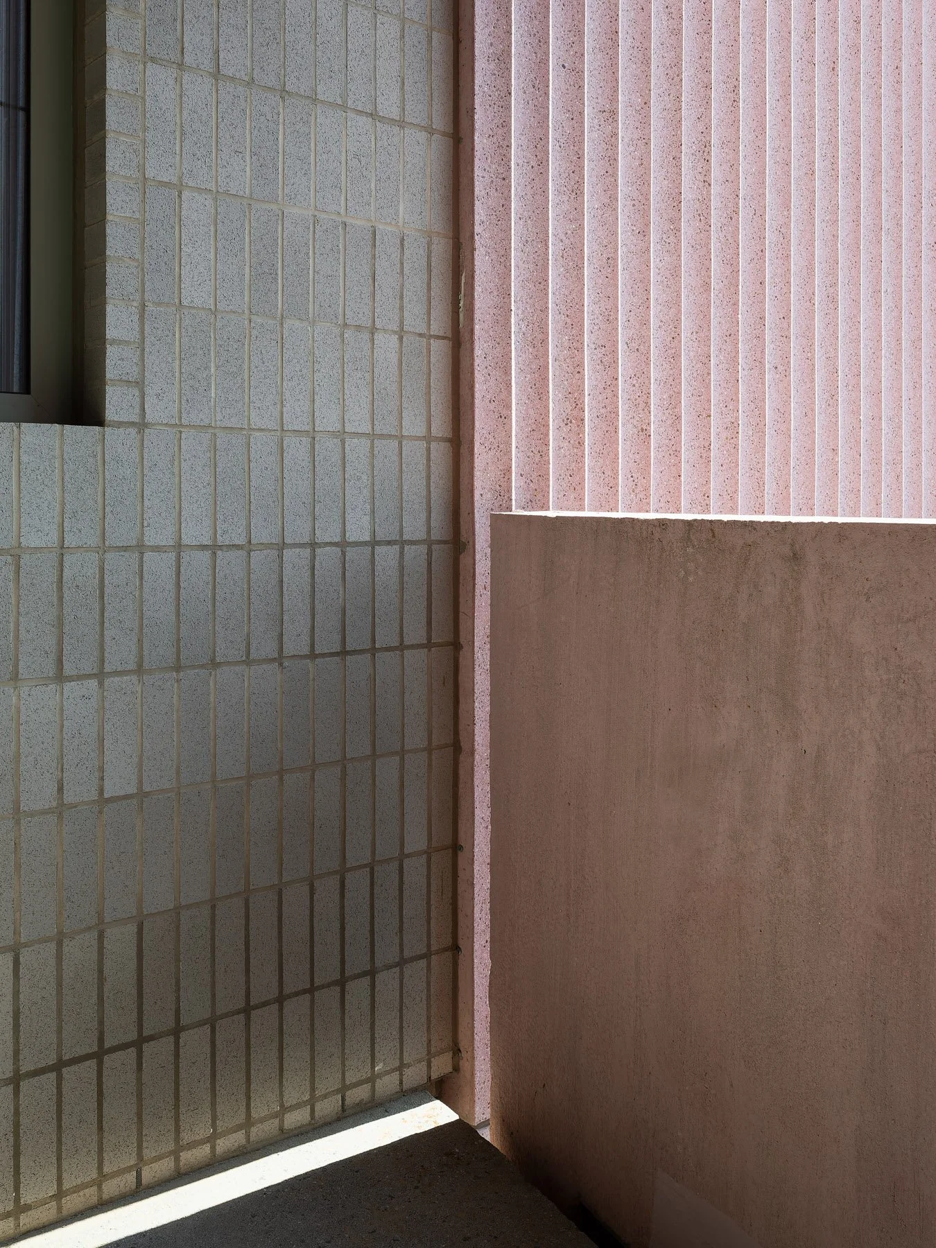 144 Vanderbilt gray gridded tile meeting pink scalloped precast at a corner, by SO-IL, Brooklyn - architectural photographer New York