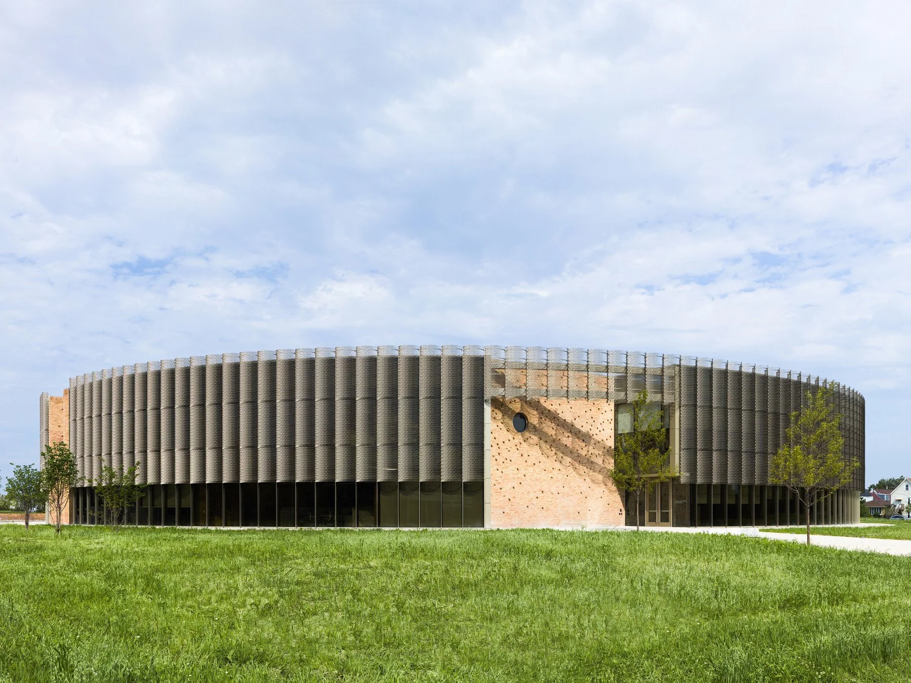 Chicago Park District HQ circular building south elevation with expanded metal screen and brick core, by John Ronan Architects - architectural photographer Chicago Illinois