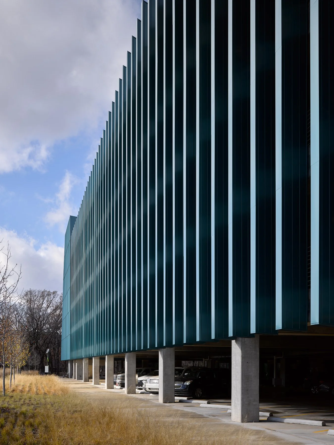 Crystal Bridges Parking raking perspective of the deep teal fins on columns, by Marlon Blackwell - architectural photographer Bentonville Arkansas