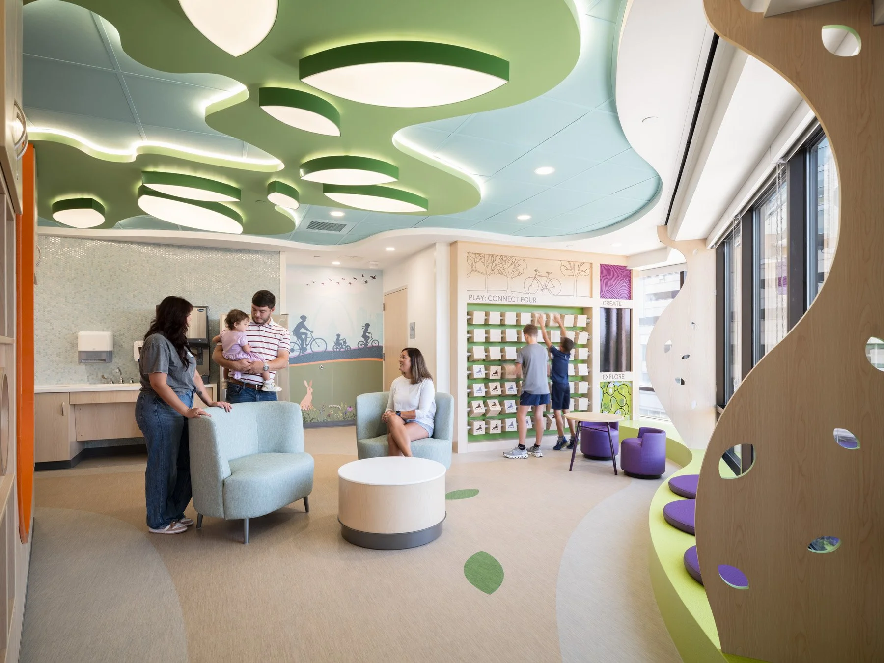 St. Louis Children’s Hospital family lounge with play wall and Gateway Arch mural, by CannonDesign - architectural photographer St. Louis Missouri