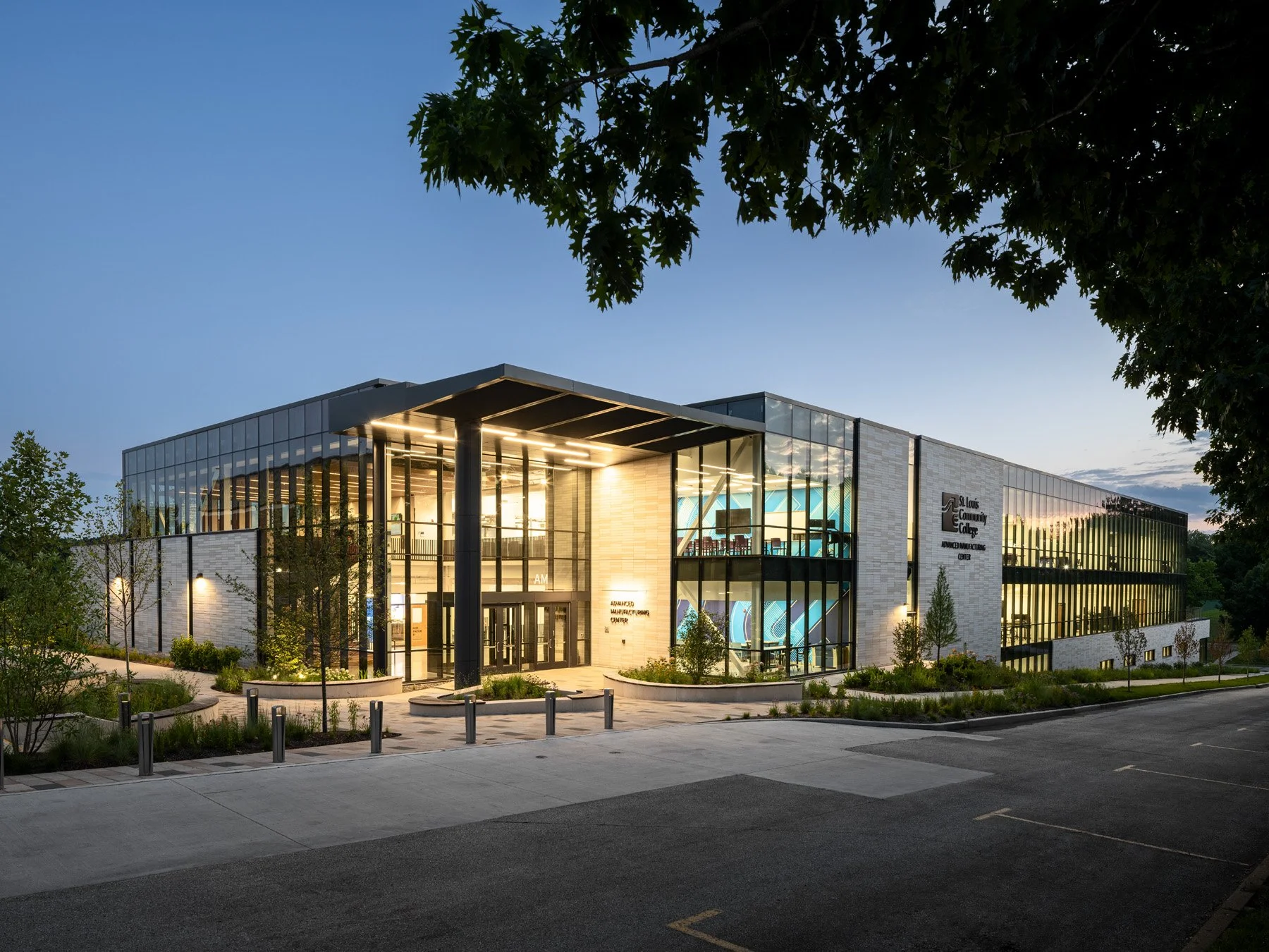STLCC Florissant Valley Advanced Manufacturing Center twilight exterior and entry canopy by JEMA - architectural photographer St. Louis Missouri