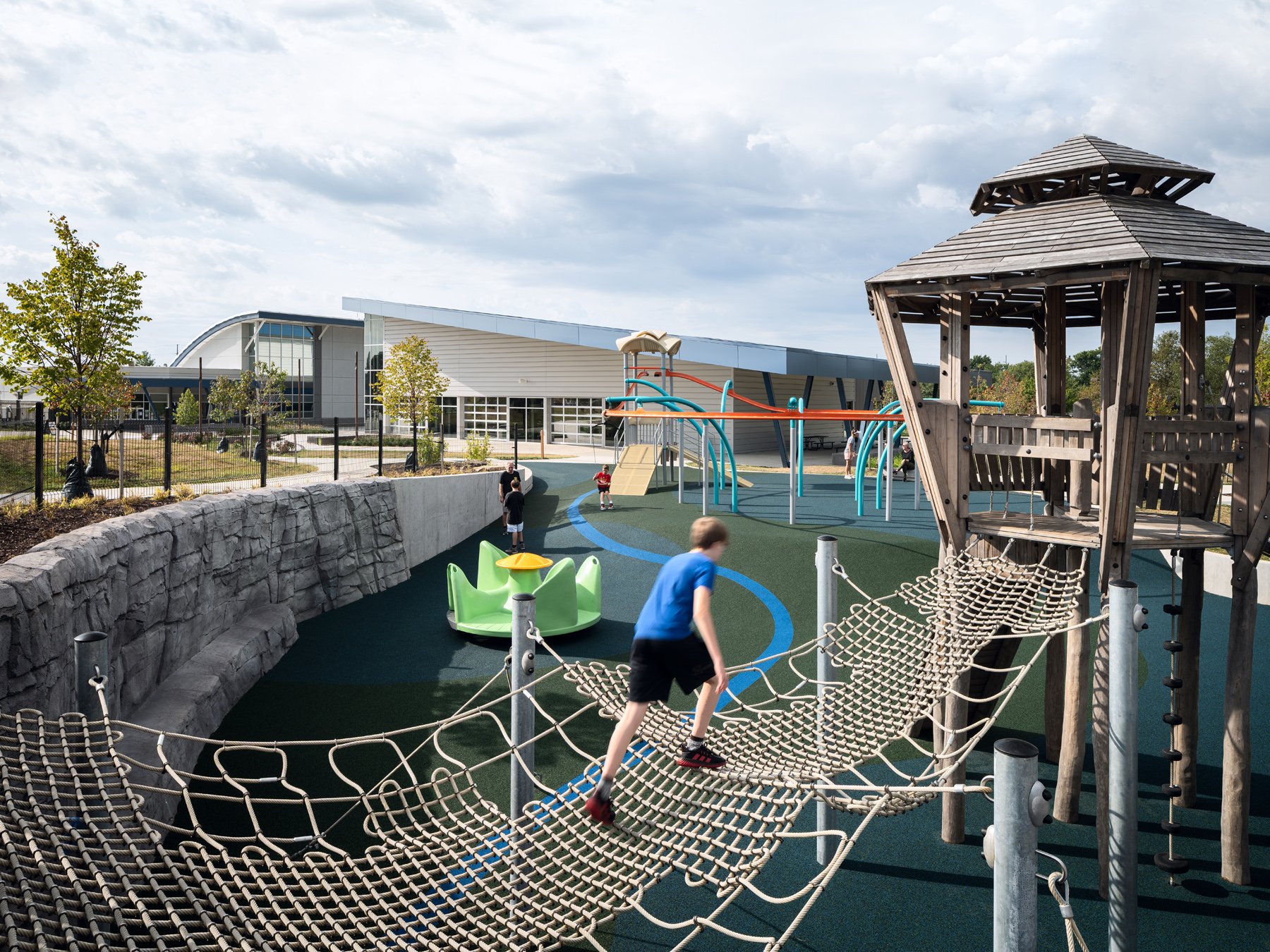 Kinetic Park rope net bridge and timber lookout tower over rubber paths, landscape by DG2 Design - architectural photographer St. Louis Missouri