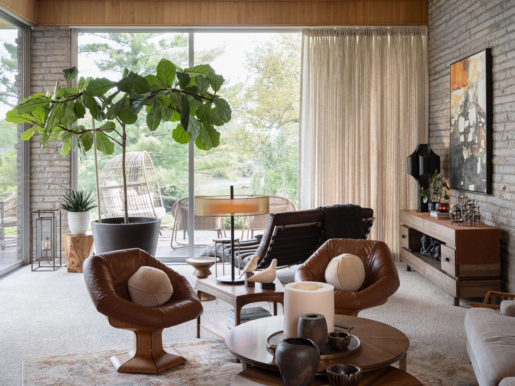 Garrison House living room glass wall opening to the deck and oak grove, Sleepy Hollow Illinois - architectural photographer Chicago