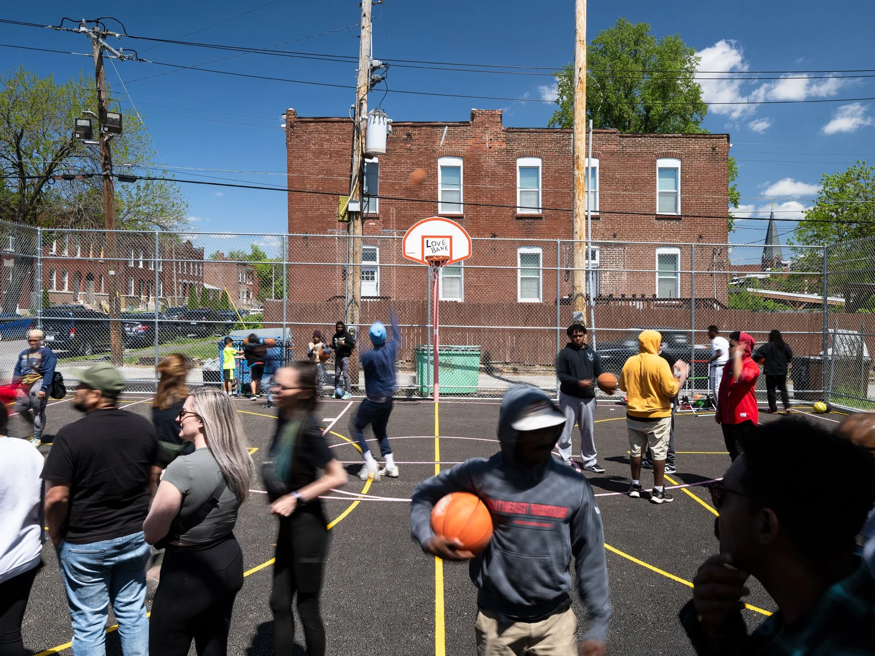 Love Bank Park opening-day crowd on the basketball court, by Patterhn Ives and Arbolope Studio - architectural photographer St. Louis Missouri