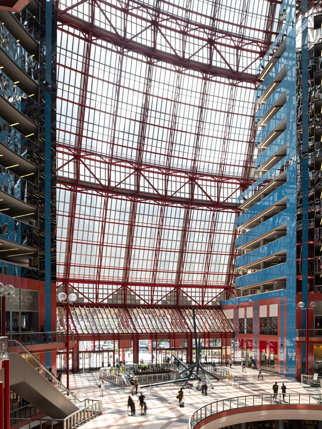 James R. Thompson Center atrium beneath the sloped red space frame skylight, blue core at right, Chicago - before renovation