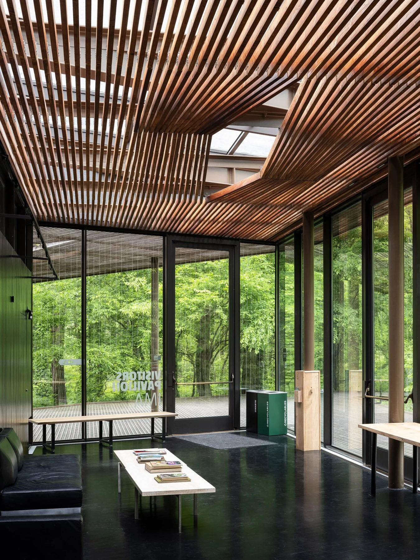 Ruth Lilly Visitors Pavilion interior with curved wood slat ceiling, skylight opening, and full-height glazing to forest, by Marlon Blackwell Architects, Indianapolis Indiana - architectural photographer