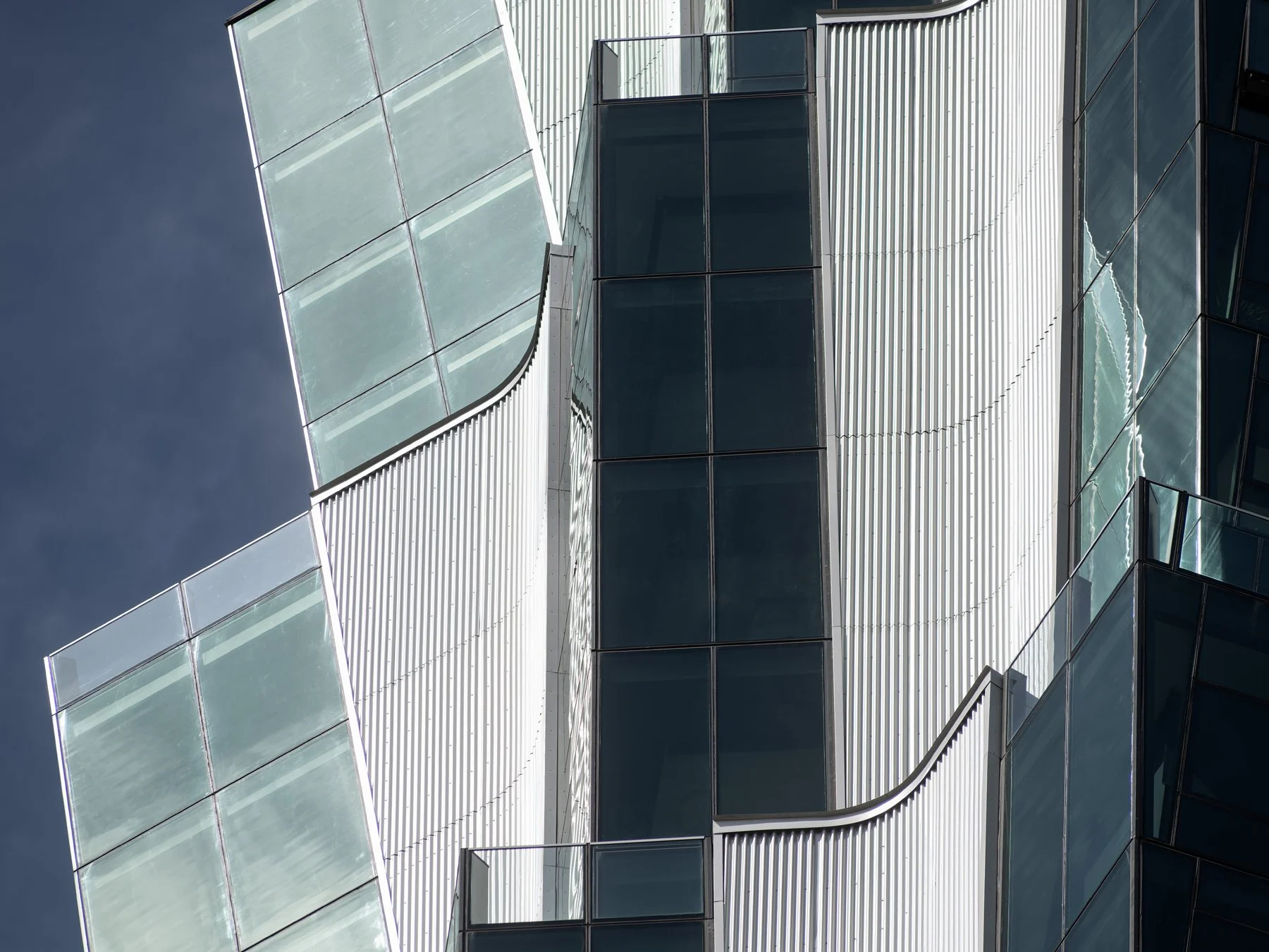 One Hundred Above the Park facade detail showing corrugated aluminum panels and angled glazing bays, by Studio Gang - architectural photographer St. Louis Missouri