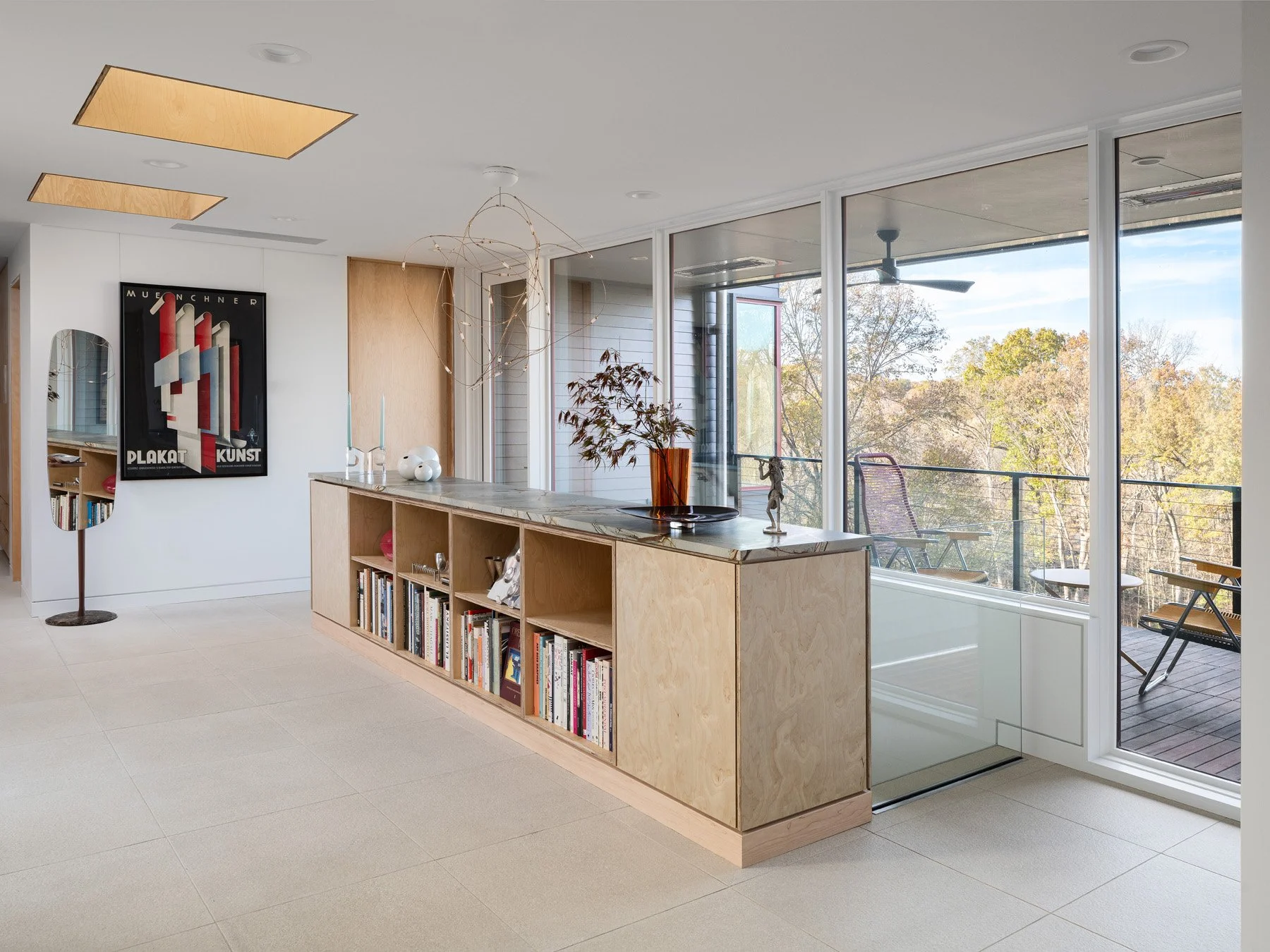 Monty Residence interior living area with a birch plywood console and stone top, by Studio Lark - architectural photographer St. Louis Missouri