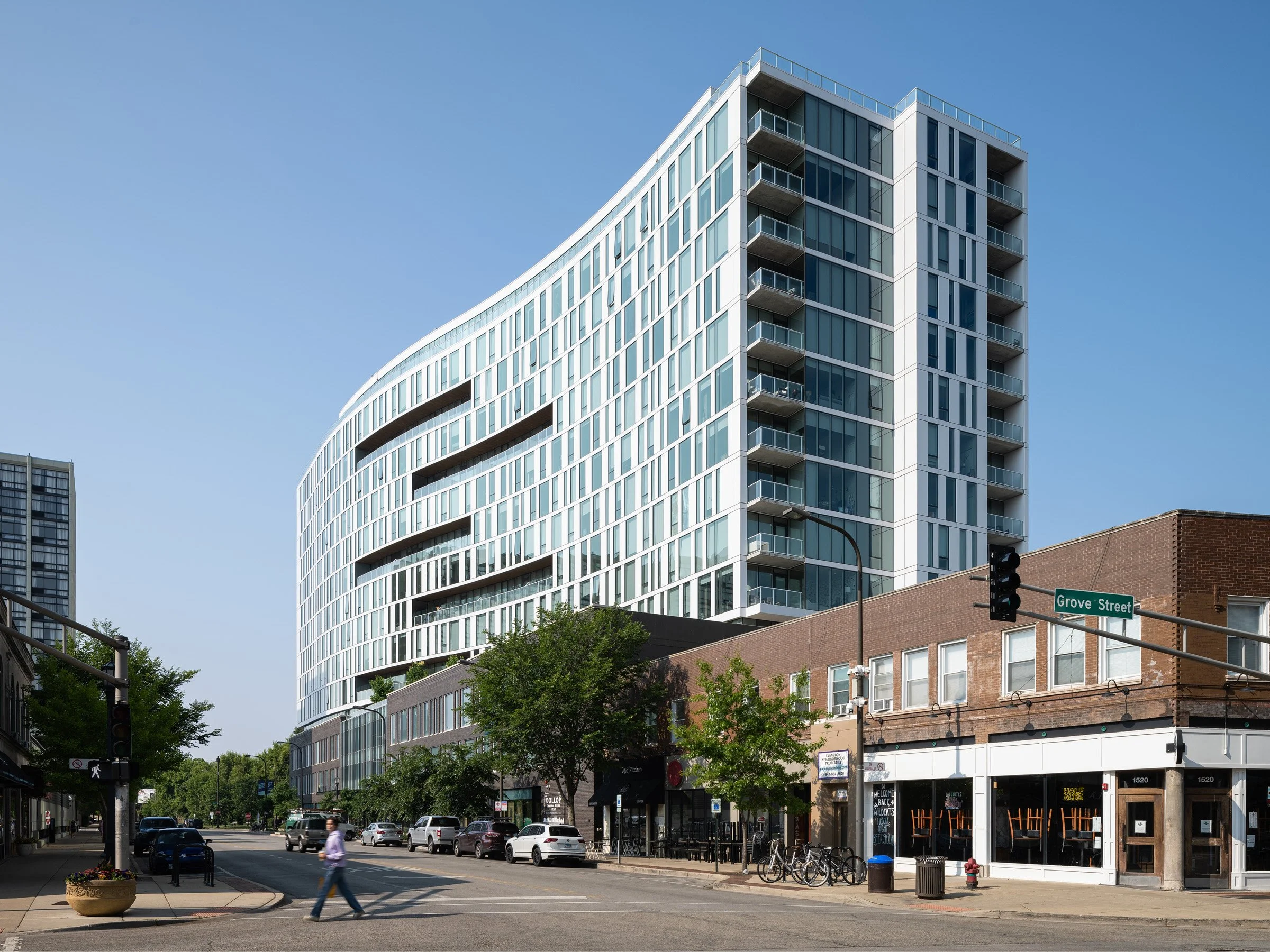 Ground-level view of Albion Evanston, showing the building's exterior and street context in downtown Evanston.