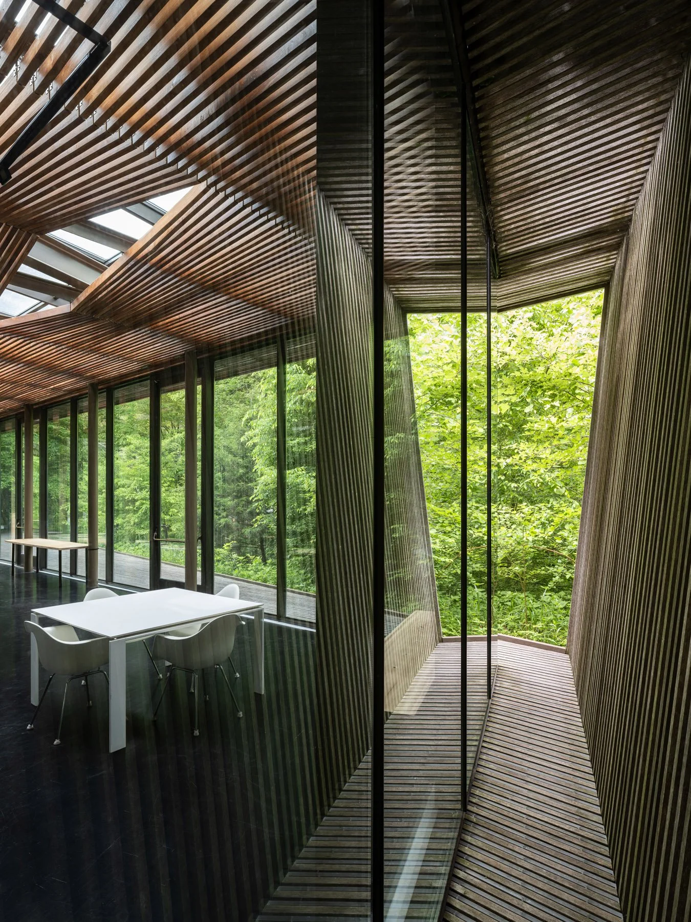 Ruth Lilly Visitors Pavilion interior corner with layered wood screen and glass looking onto the wooded deck, by Marlon Blackwell Architects, Indianapolis Indiana - architectural photographer