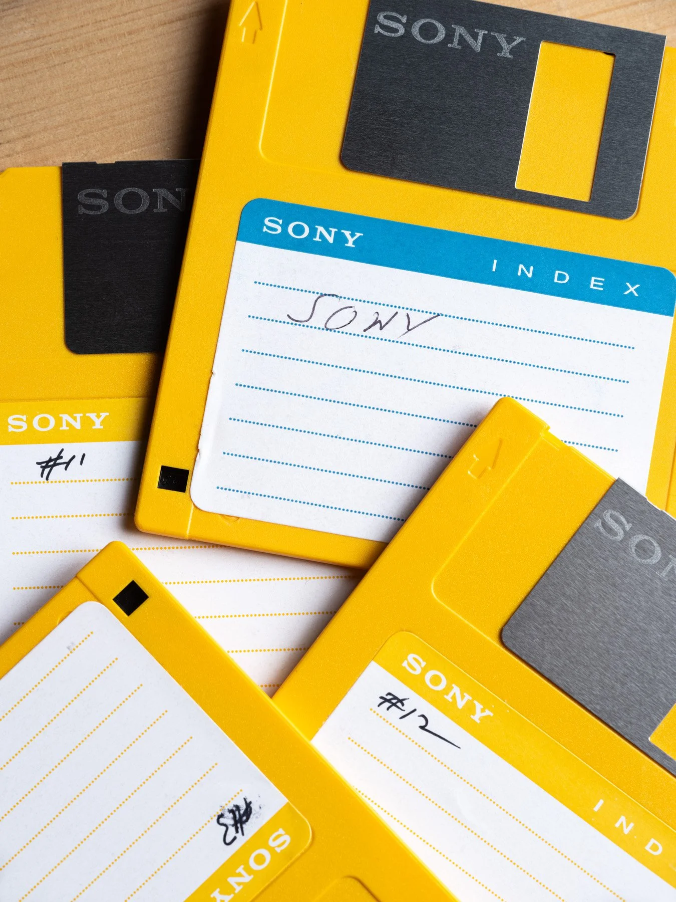 Yellow Sony 3.5-inch floppy disks for the Digital Mavica, hand-labeled in pen - architectural photographer St. Louis Missouri