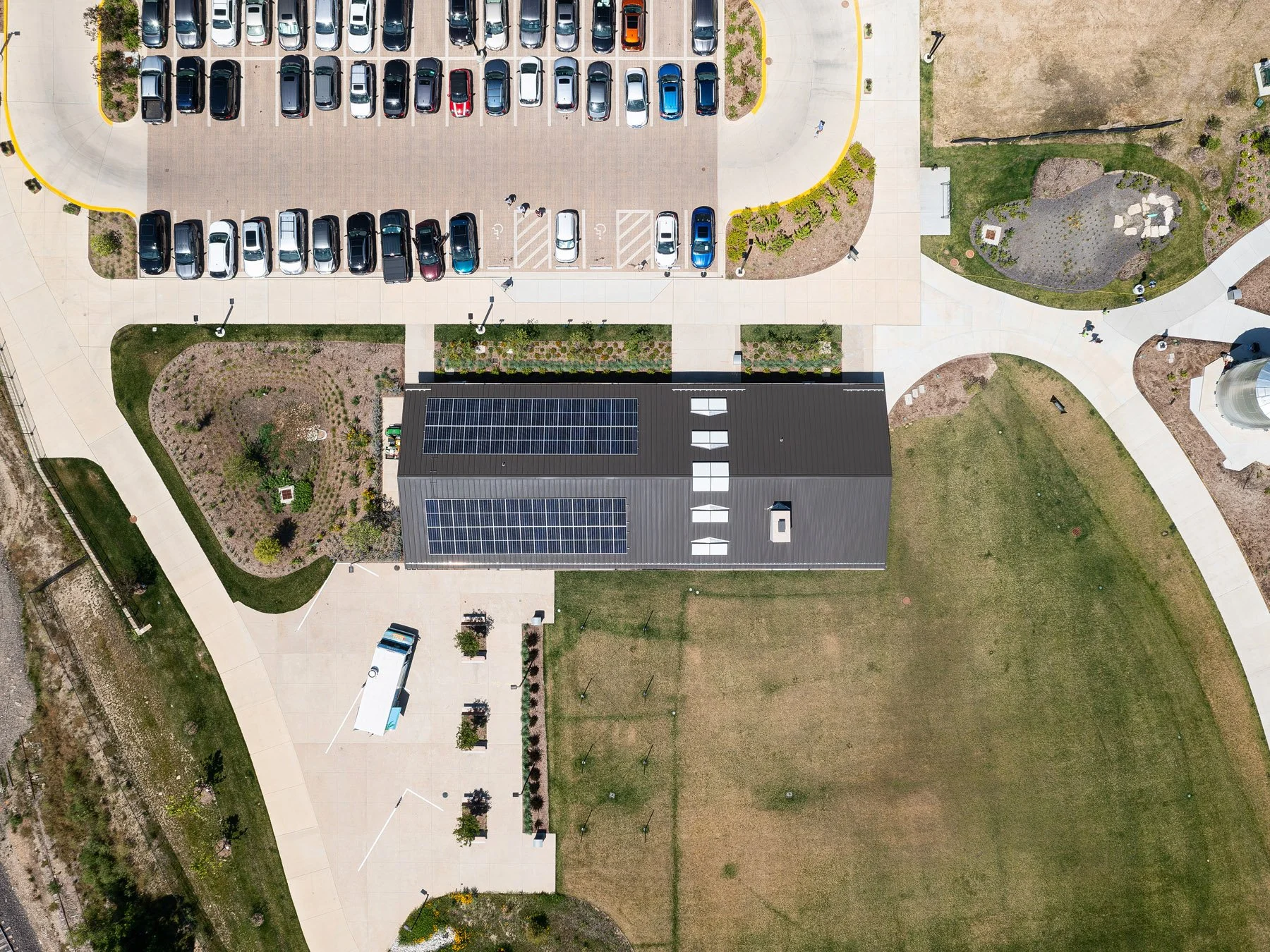 Brentwood Park Event Pavilion overhead aerial of solar-covered standing-seam roof and site, by Christner - architectural photographer St. Louis Missouri
