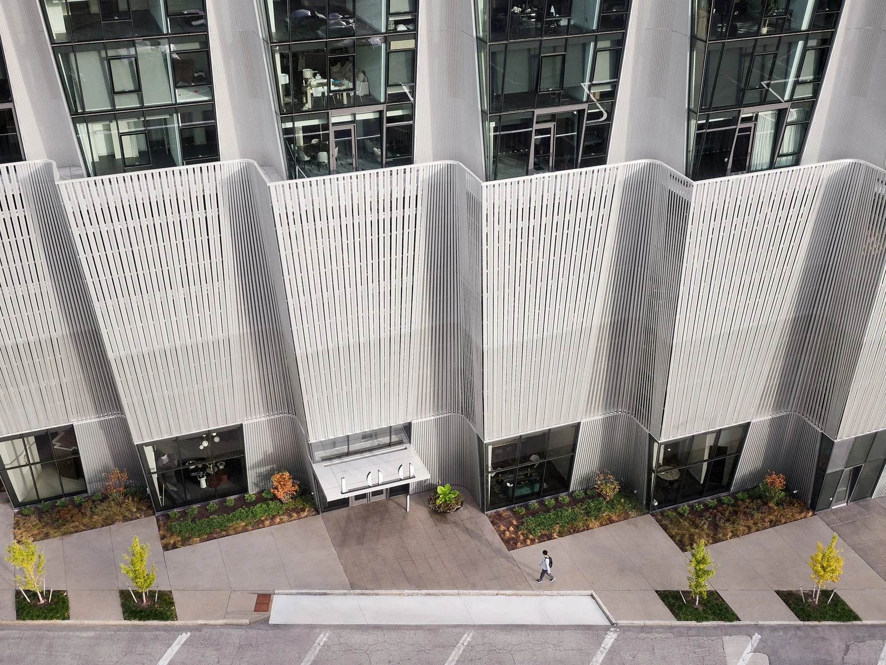 One Hundred Above the Park aerial view of podium entry and corrugated aluminum cladding, by Studio Gang - architectural photographer St. Louis Missouri