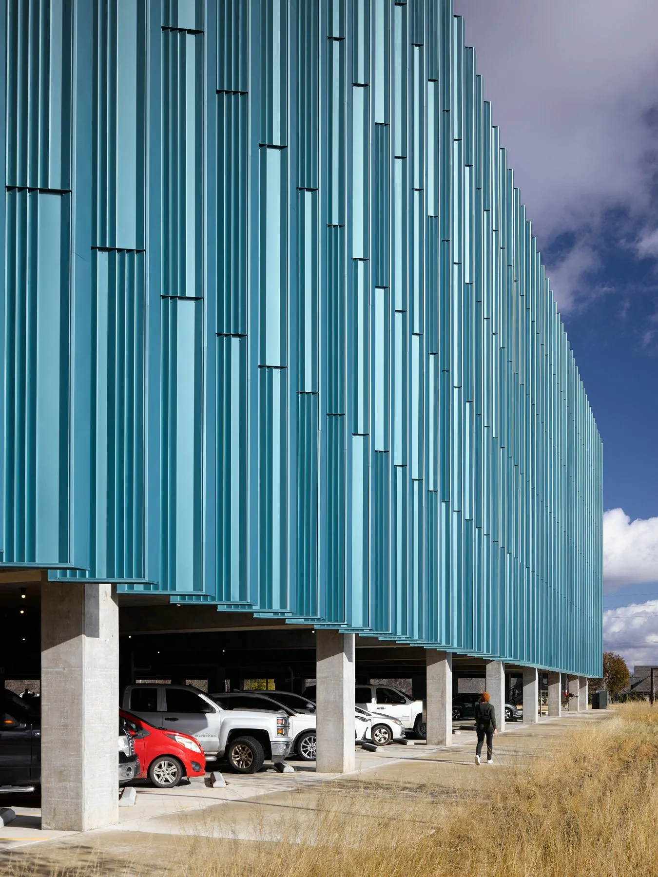 Crystal Bridges Parking cars in the open undercroft beneath the lifted fins, by Marlon Blackwell - architectural photographer Bentonville Arkansas