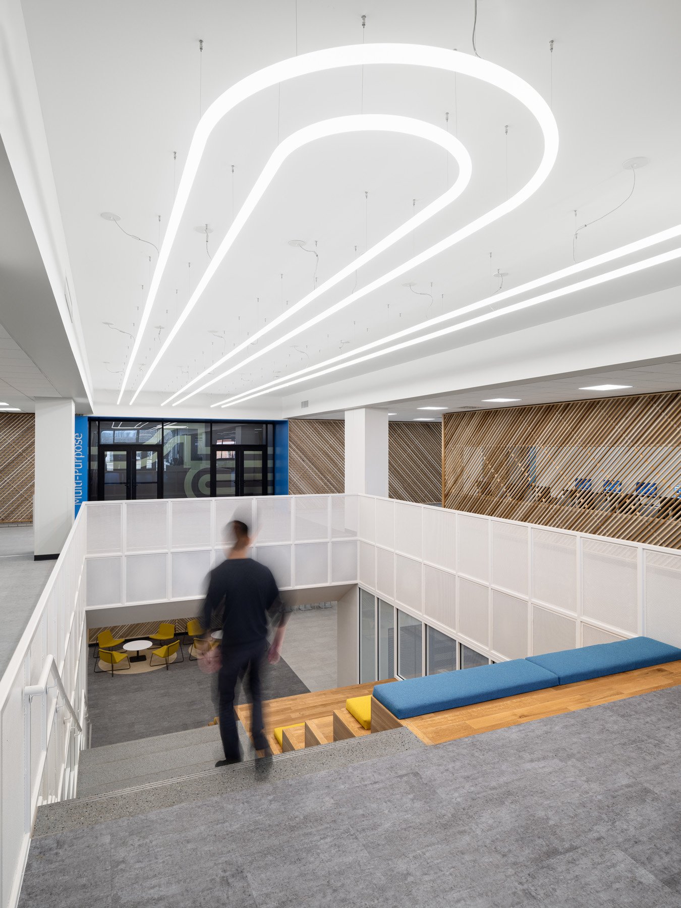 STLCC Florissant Valley Student Center looping pendant light over the stair by JEMA, Ferguson Missouri - architectural photographer St. Louis