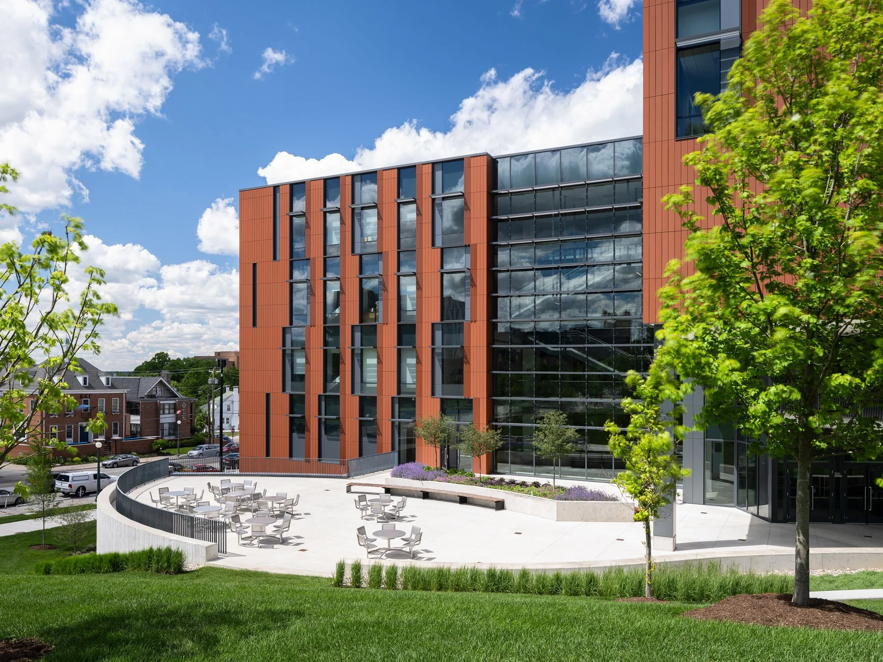 Clifton Court Hall terracotta facade with curved plaza seating area, by LMN Architects and KZF Design - architectural photographer Cincinnati Ohio