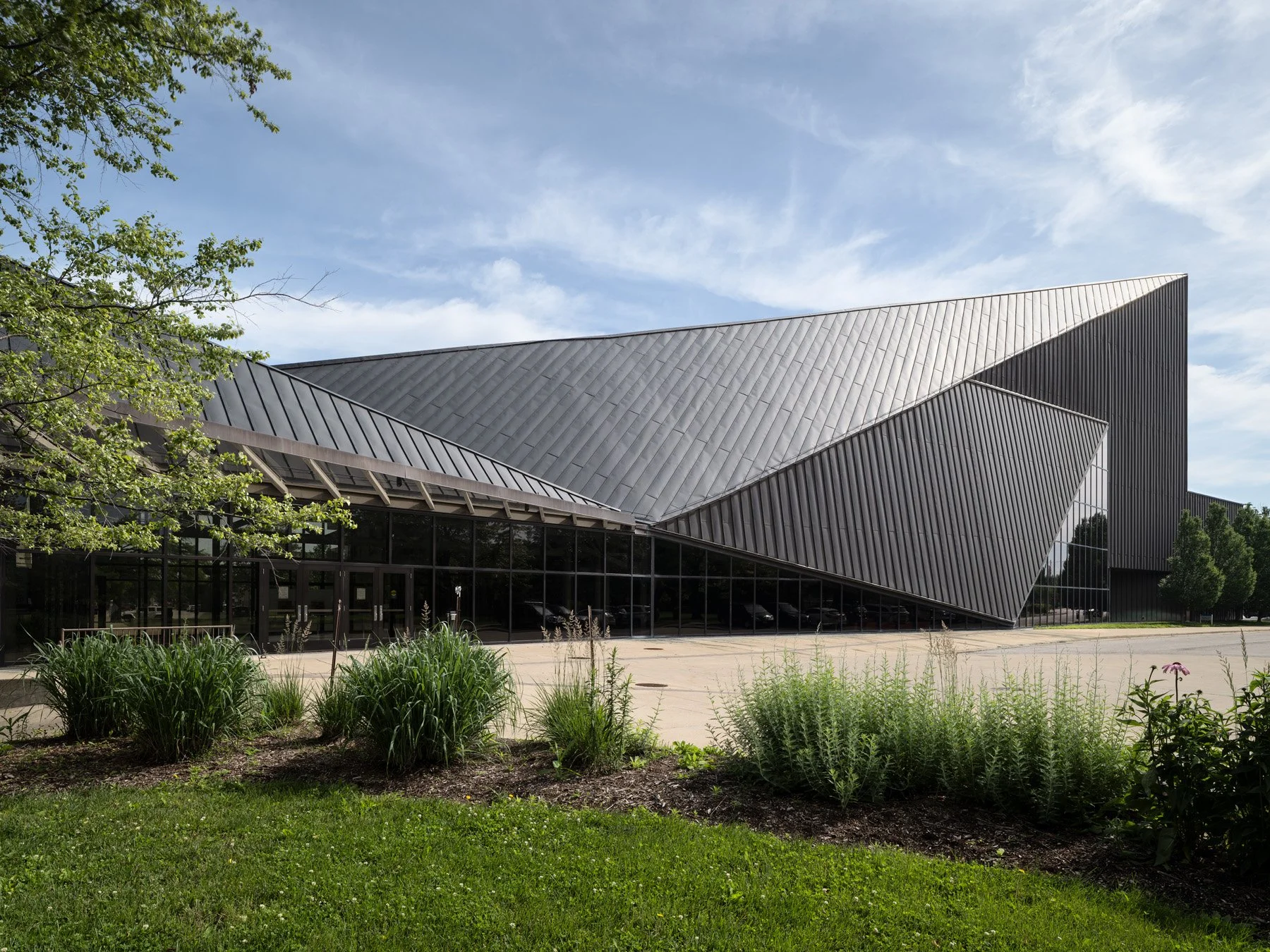 Doudna Fine Arts Center exterior with dark copper canted roof over the glazed entry concourse by Antoine Predock, Charleston Illinois - architectural photographer