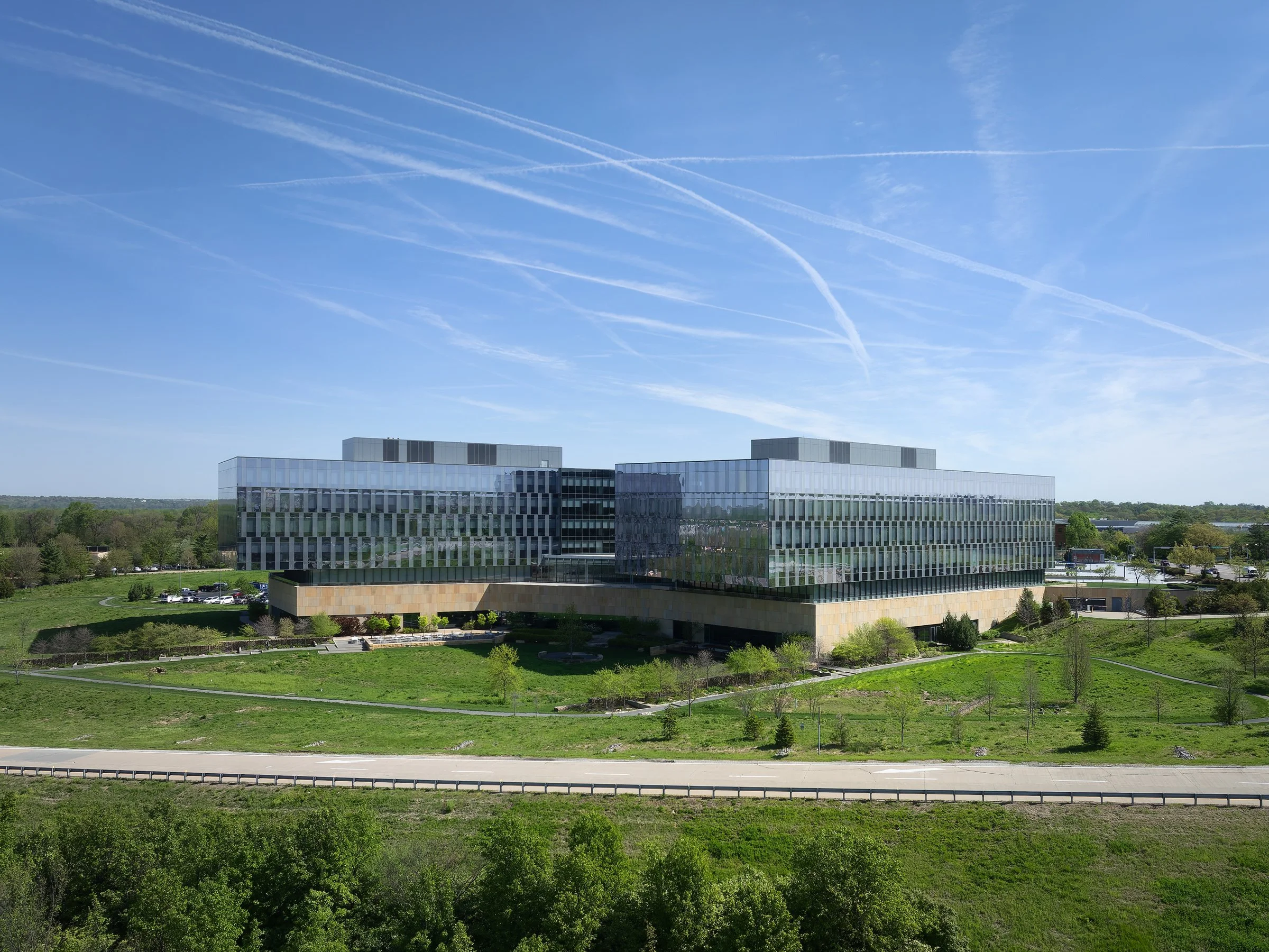 Reinsurance Group of America twin offset glass towers over stone amenity base by Gensler, Chesterfield Missouri - architectural photographer St. Louis
