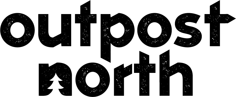 Text reading 'outpost north' in bold, black font with a distressed, textured style.