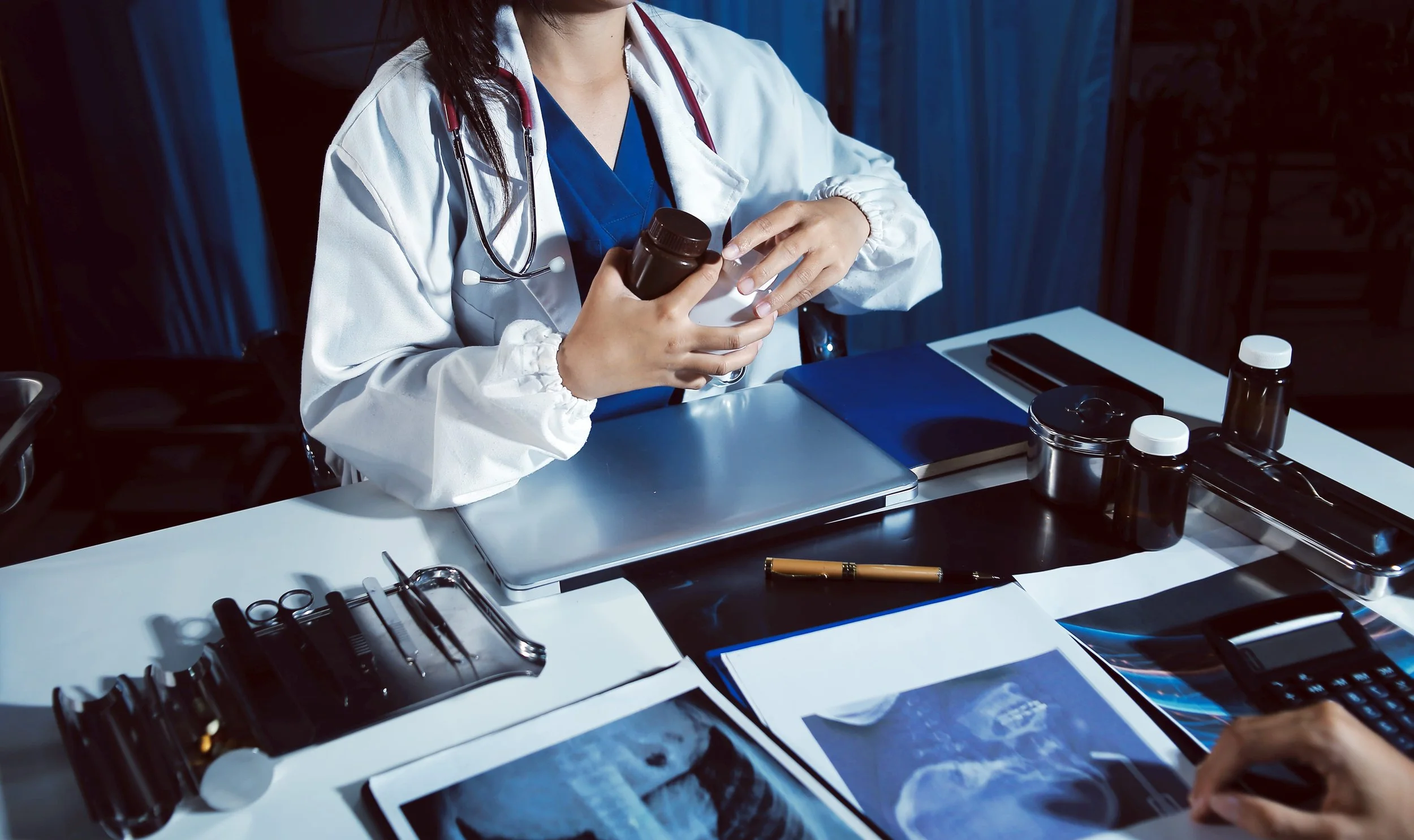 Doctor reviewing patient medical records, illustrating a medical malpractice claim handled by Inabnit Law Office