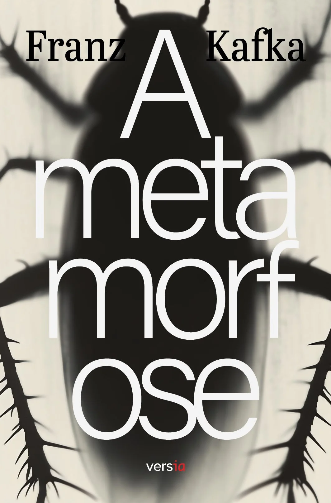 Imagem da capa do livro 'A Meta', de Franz Kafka, com uma silhueta de inseto no fundo e o título em letras brancas grandes.