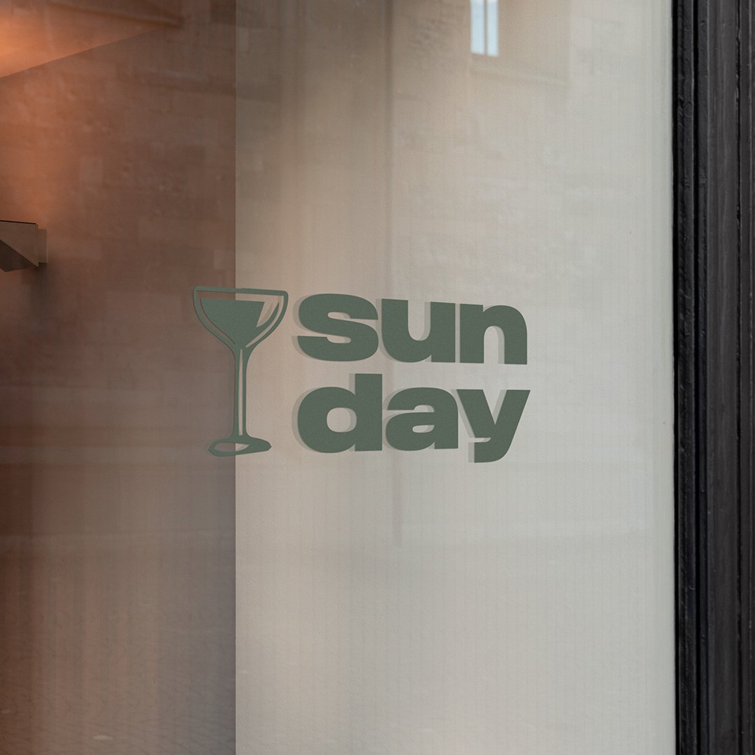 Logo design placed on the window of a cocktail bar