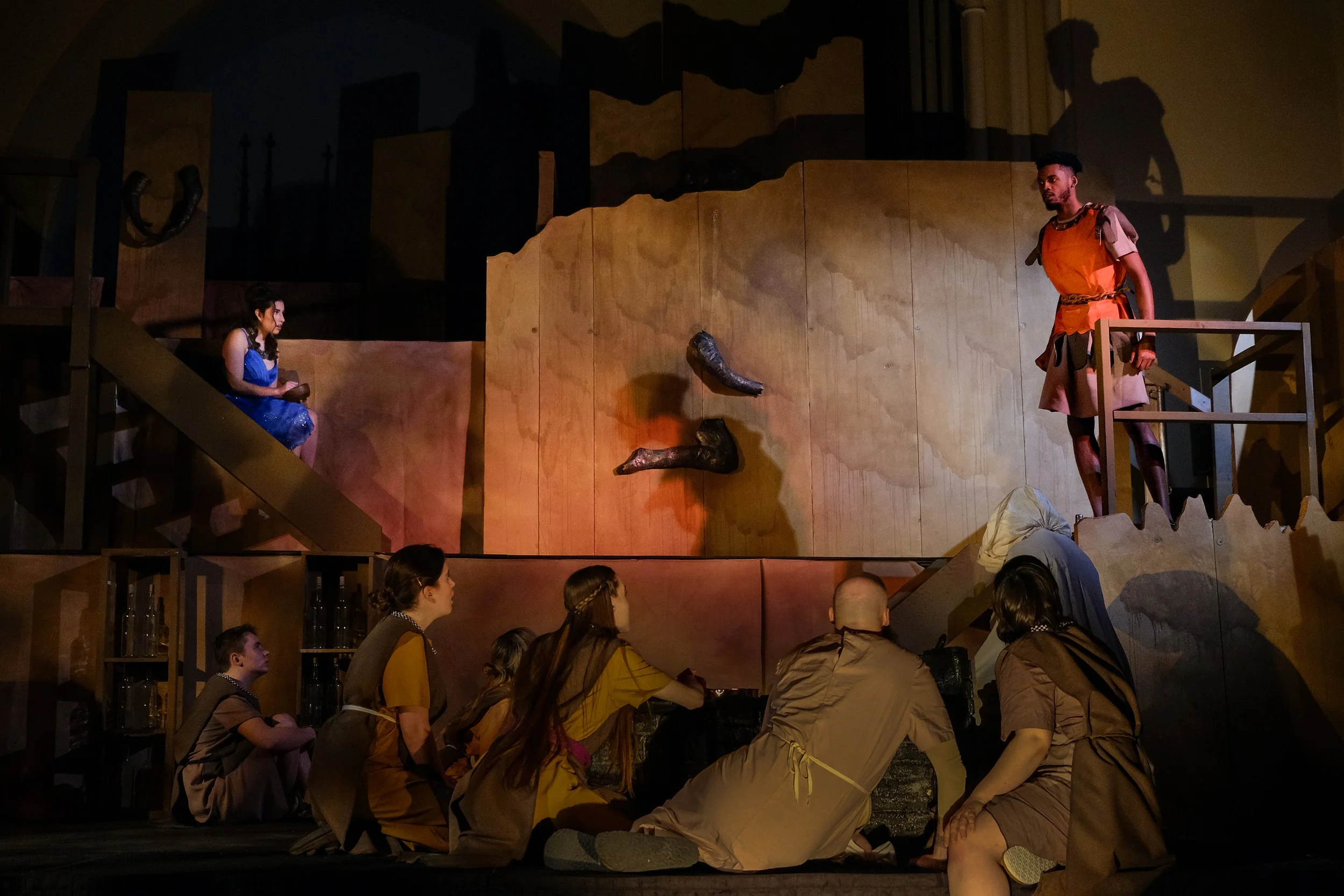 *Prince Cadmus (Seymour Irons) telling all of the unnamed characters his story of what brings him to the house of Ares, God of War