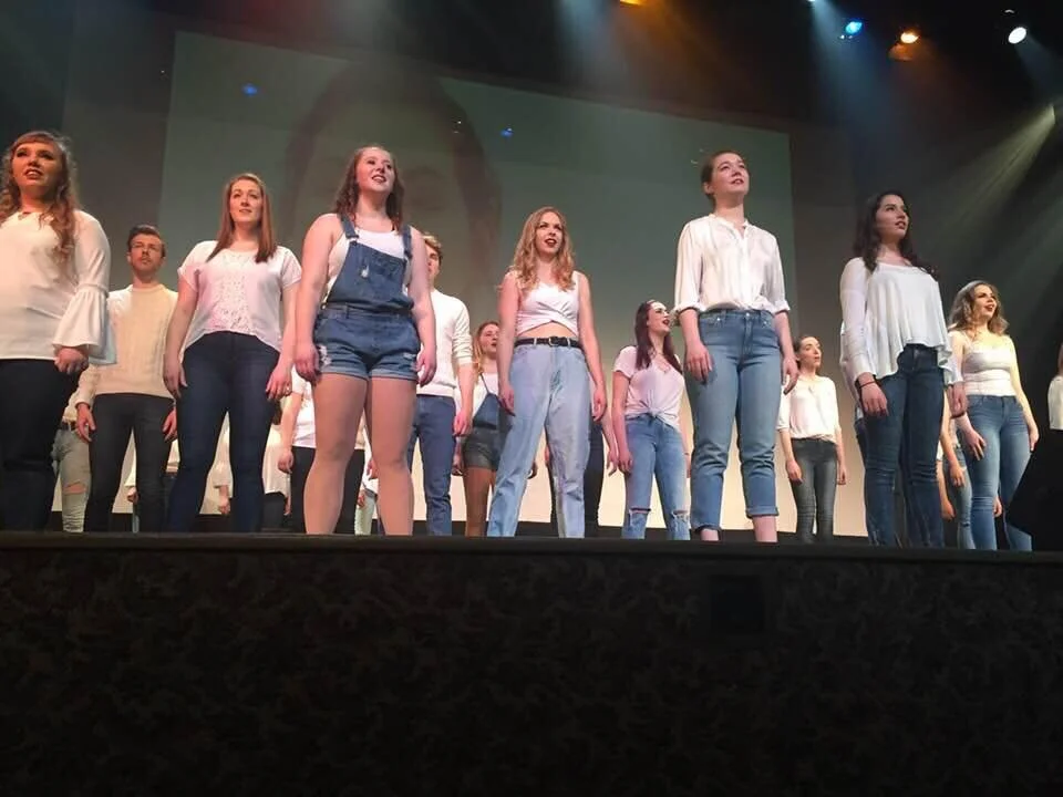 Taken during the final number of our show. As the first year class we sang "You Will Be Found" from Dear Evan Hansen. It was so special because one of our classmates taught us the sign language of the chorus which we performed on stage. 