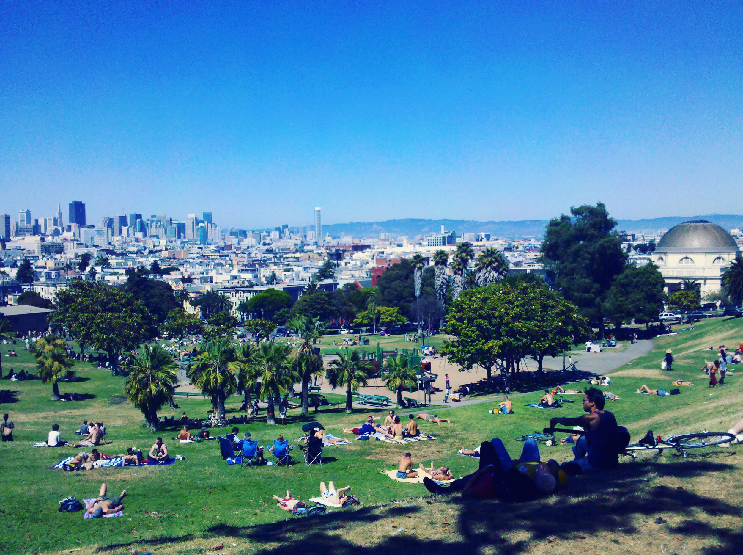 SAN FRANCISCO, CA - JUNE 27, 2010: People enjoying a sunny Sunday afternoon in Mission Dolores Park.
