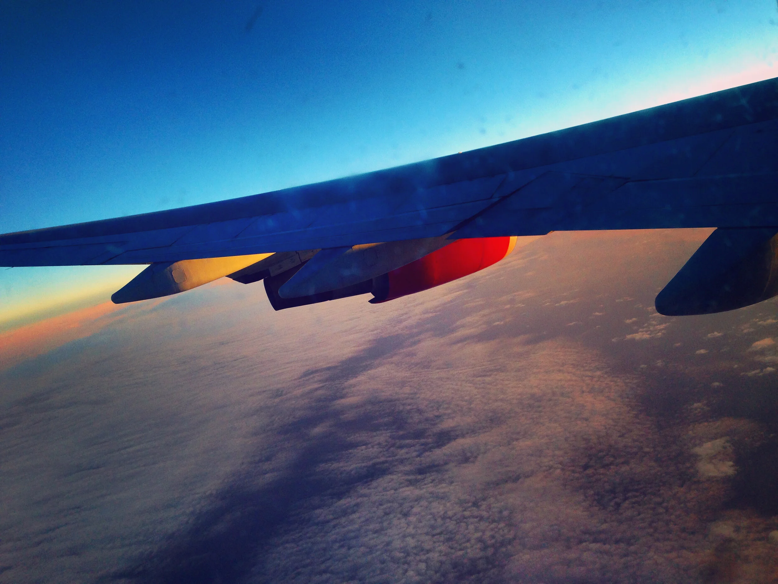 SOMEWHERE OVER THE ATLANTIC OCEAN - NOVEMBER 22, 2013: A view of the sun rising from Flight VS2 as it makes its way to London’s Heathrow Airport.