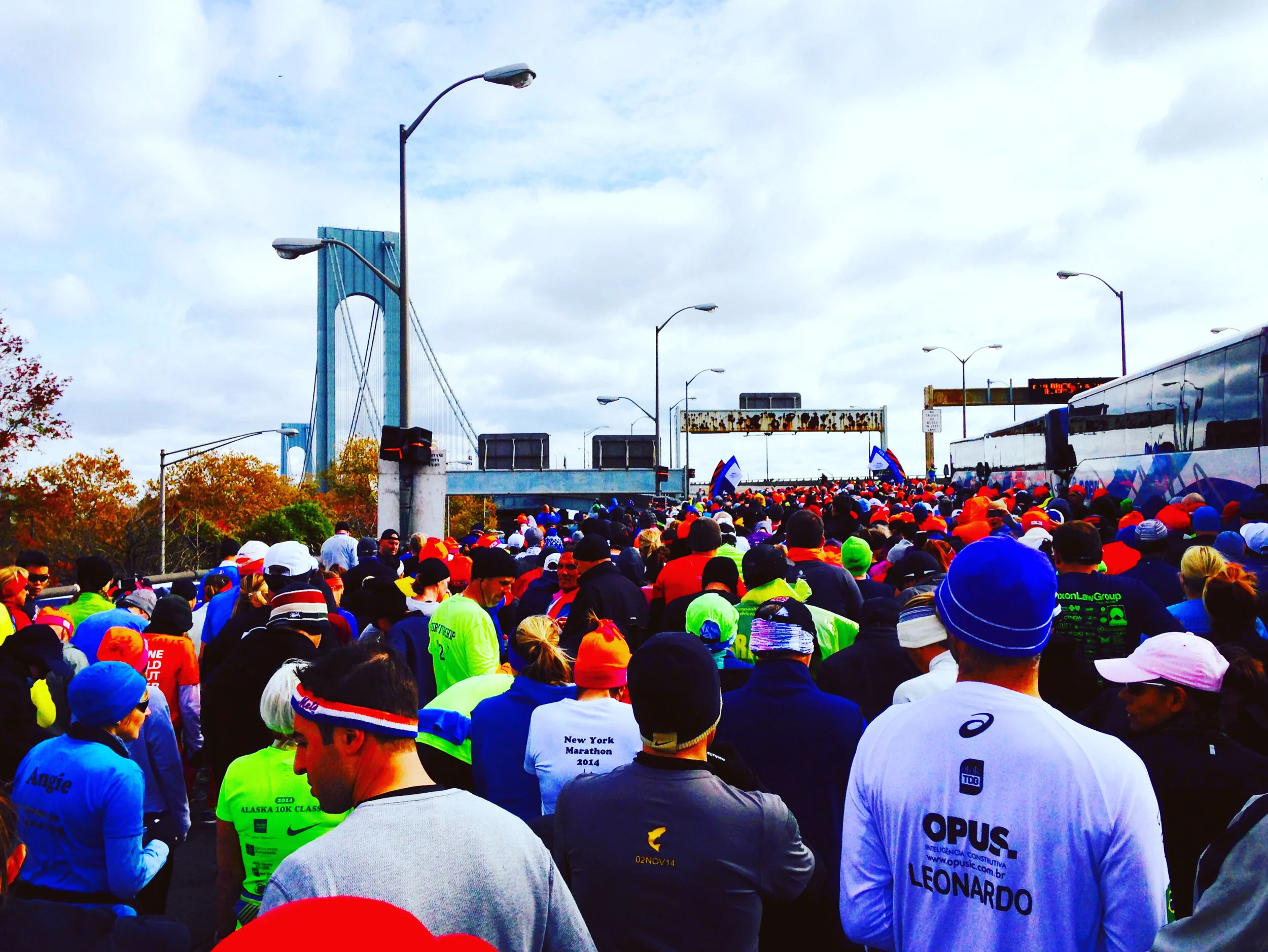 STATEN ISLAND, NY - NOVEMBER 2, 2014: Runners await the start of the 2014 New York City Marathon stop the Verrazano-Narrows Bridge.