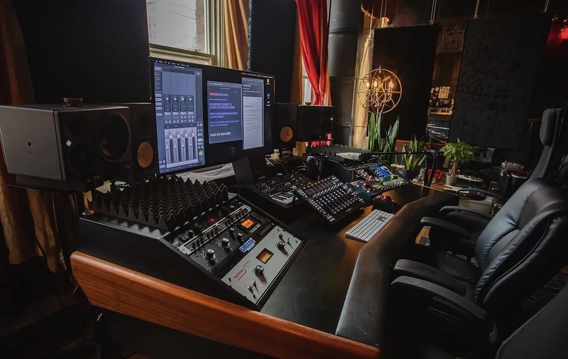 Mixing desk and studio monitors at Manic Recording Studios.
