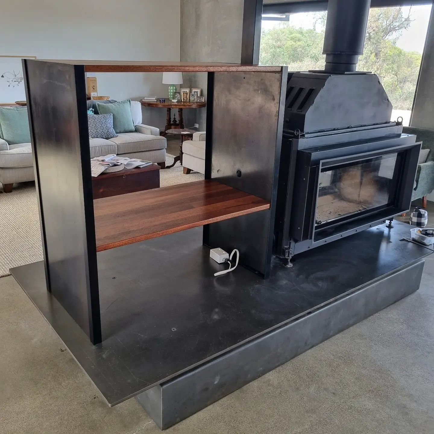 T.V unit. Wood storage at bottom.
5mm plate steel used for ends finished with oil.