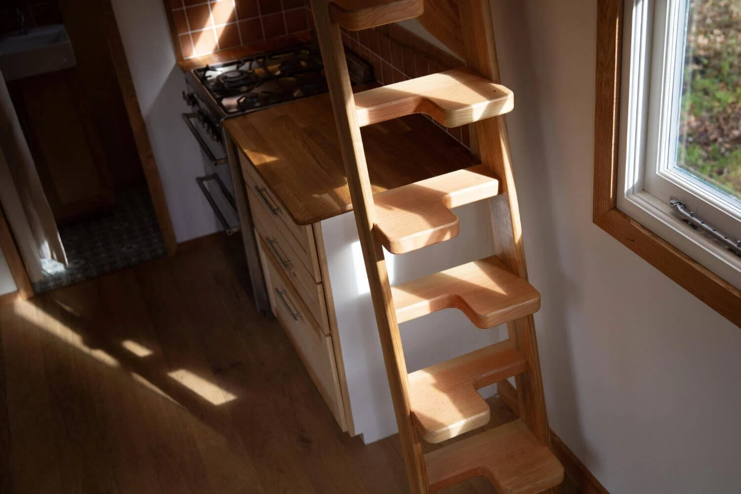 Close up of tiny house steps with sun light shining on them