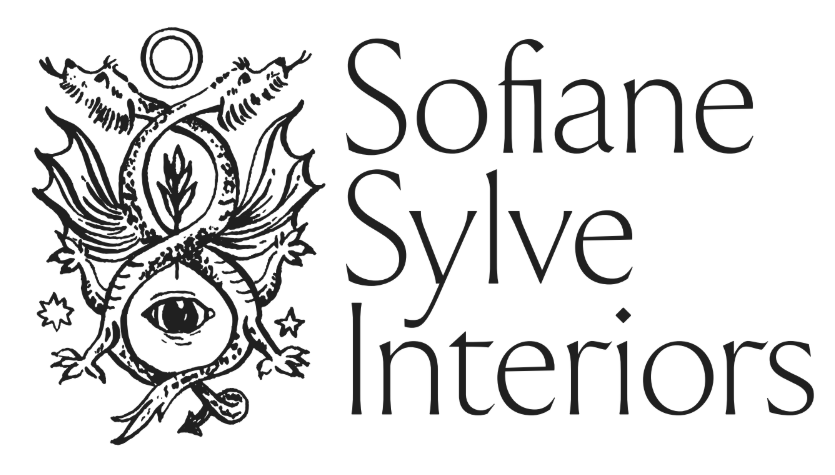 Logo for Sofane Sylve Interiors featuring a central eye, a snake entwined around its bottom, and decorative elements including cloves, star, and crescent moon, with the business name displayed in stylized font.