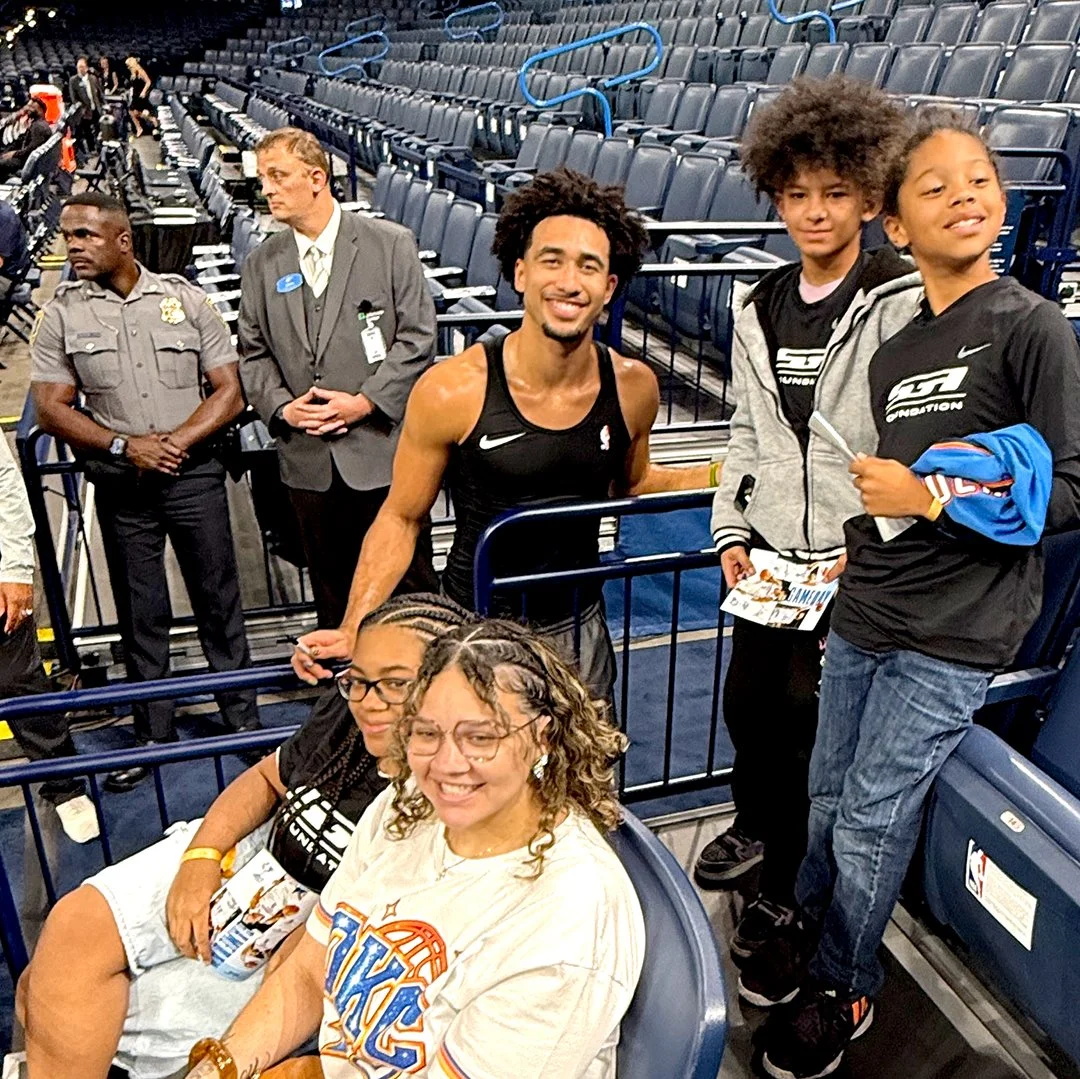 Family enjoying the Oklahoma City Thunder Game with an OKC Thunder Player, SGA Foundation
