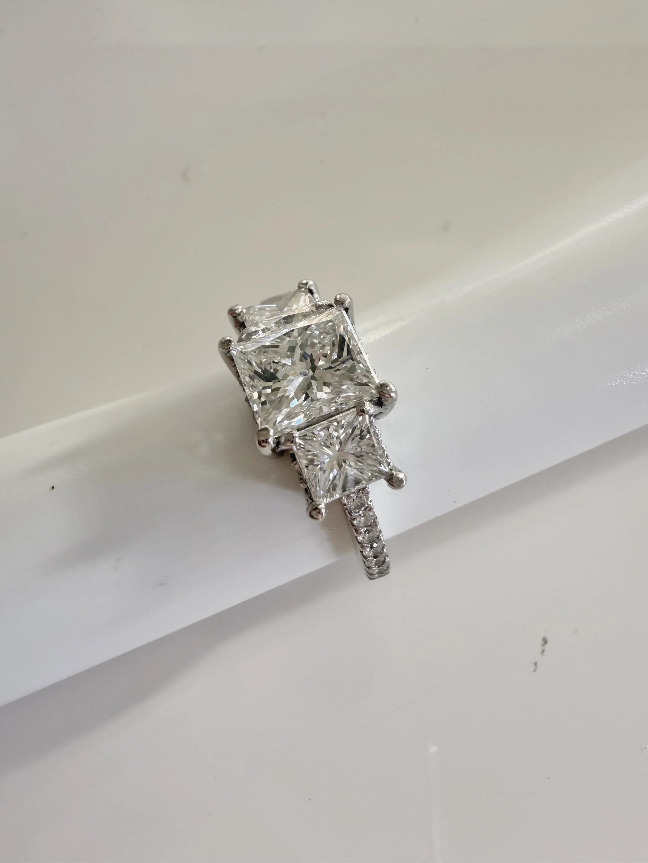 Preloved diamond engagement ring, 1.98 carats, three stones, princess cut