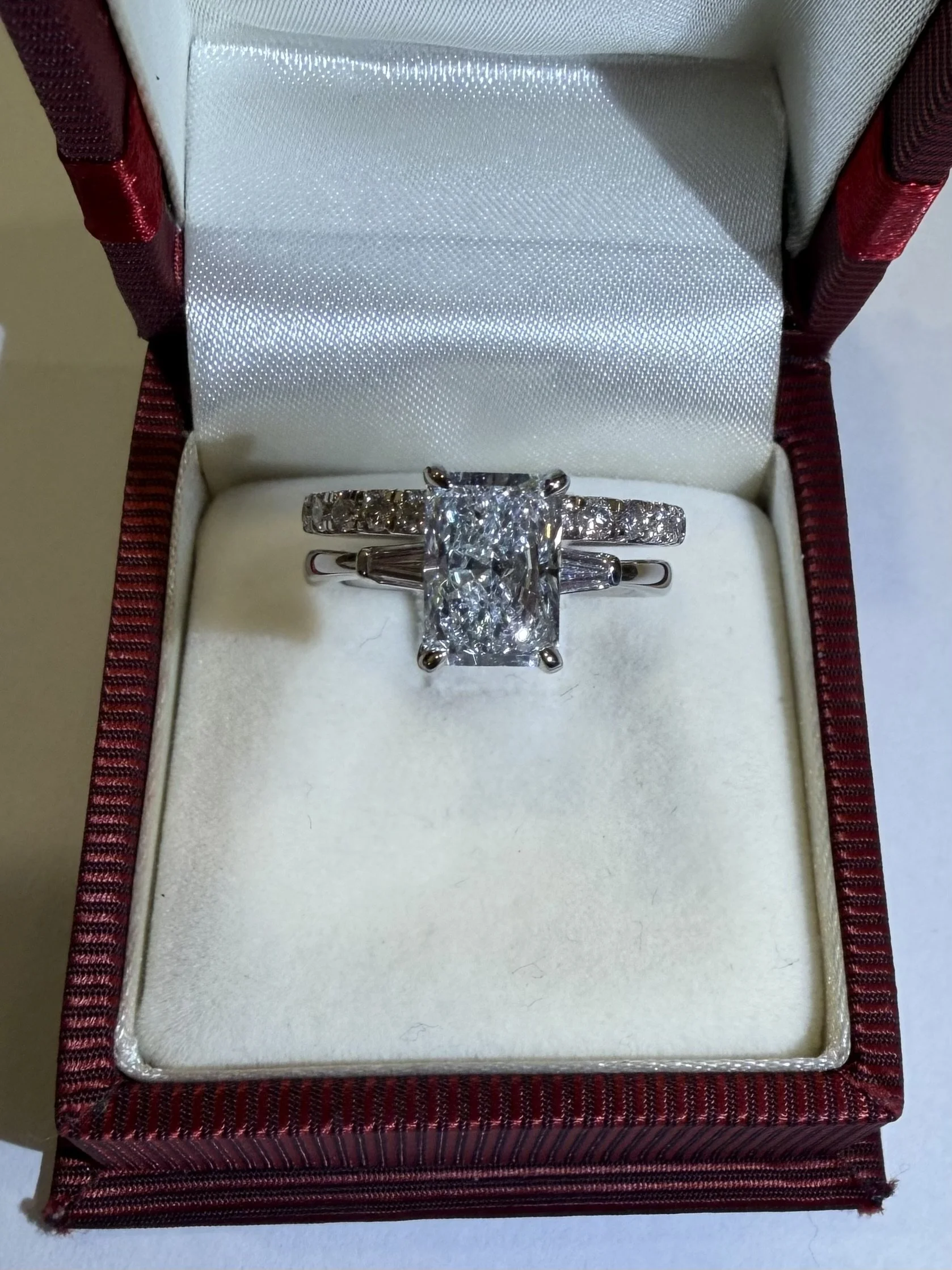 Preloved set of lab grown engagement ring and wedding band in a box